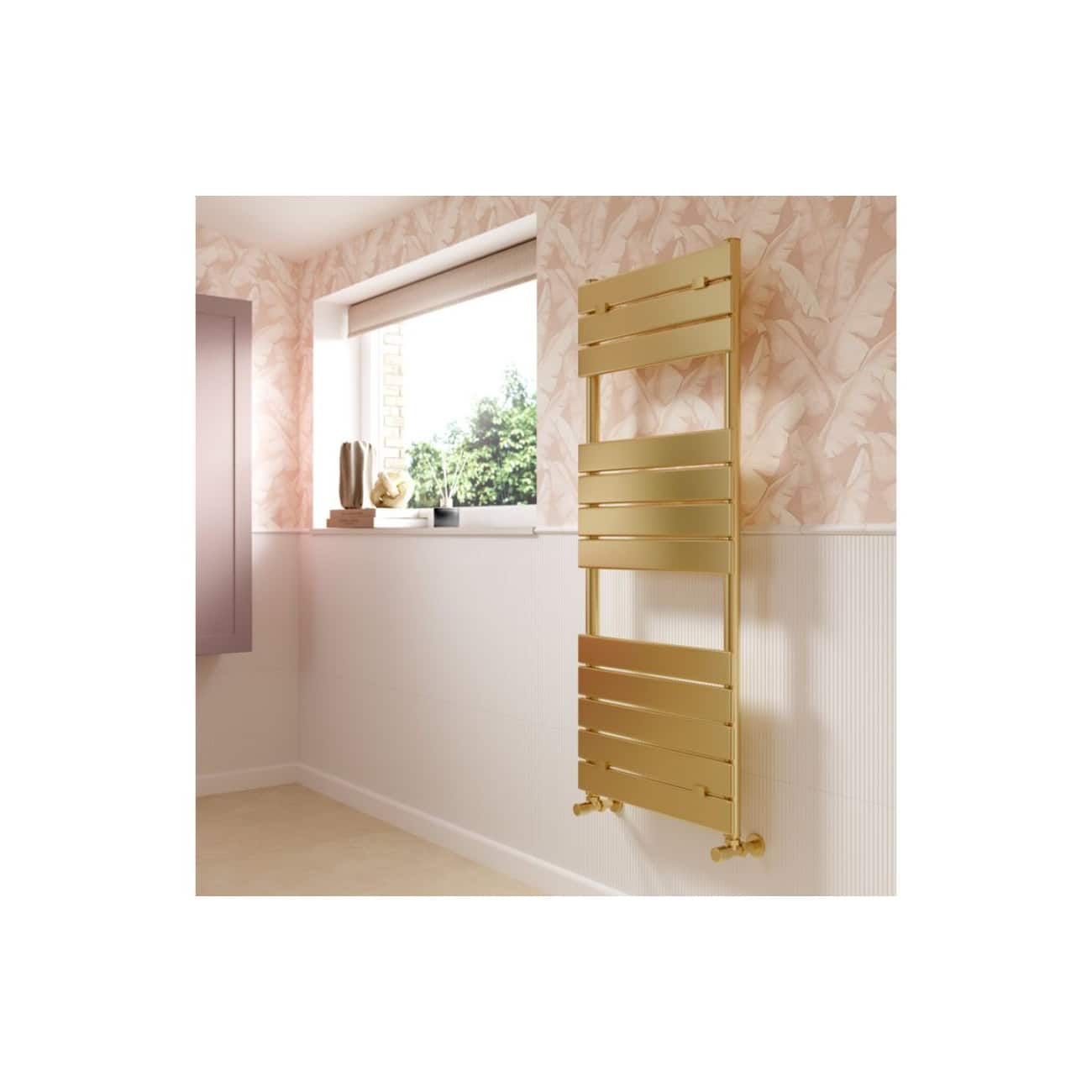 Sleek gold bathroom radiator mounted on a pastel pink wall with floral wallpaper, complemented by a window sill with decorative vases and plants, offering a modern and elegant bathroom heating solution.