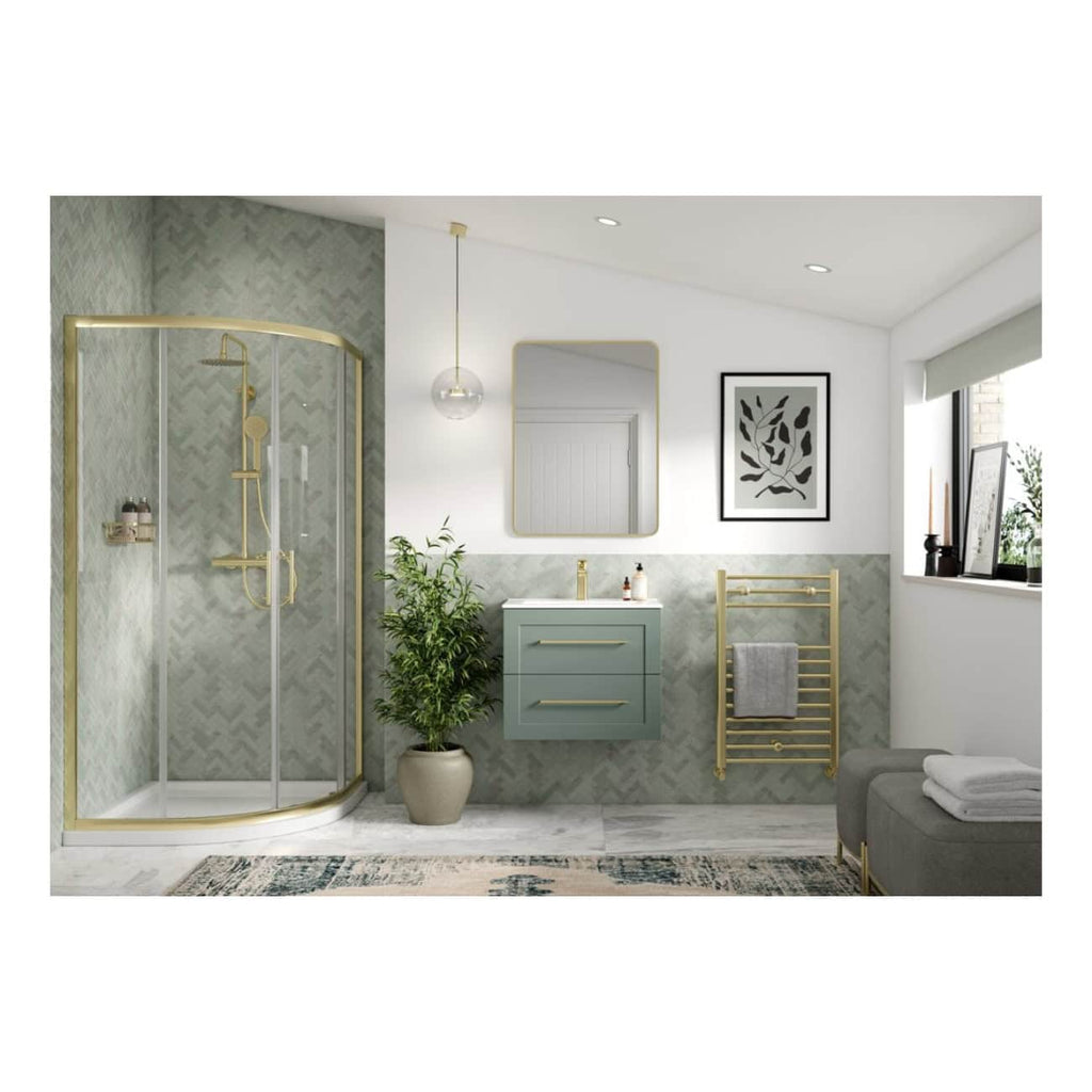 Luxurious modern bathroom with gold-accented shower enclosure, stylish vanity with gold handles, decorative mirror, artwork, and heated towel rack, featuring neutral tones and contemporary decor.