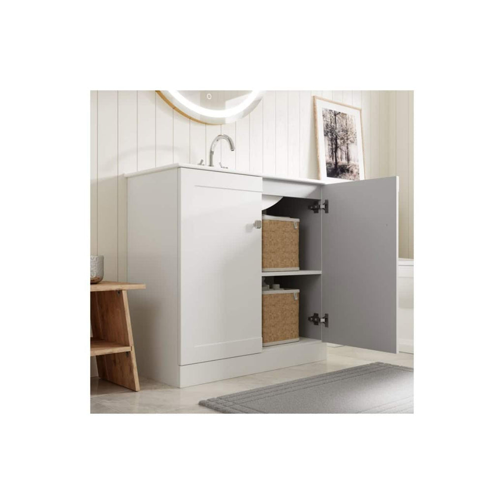 White bathroom vanity with open cabinet storage and wicker baskets, modern bathroom sink with round mirror, minimalist design, suitable for small bathrooms or powder rooms, clean and stylish look.