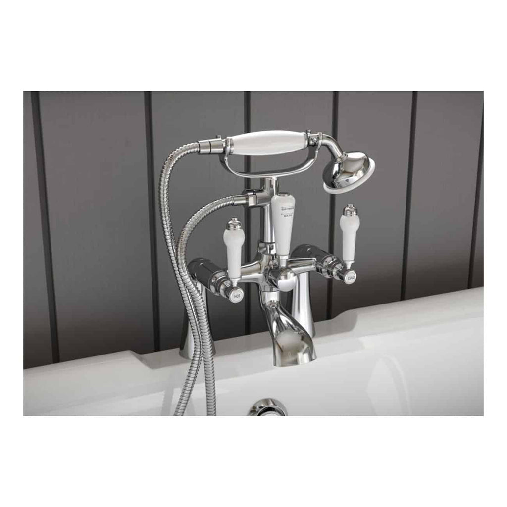 Shower and bathtub tap with handheld shower head, chrome finish, and dual controls for hot and cold water, set against a modern dark vertical panelled wall in a contemporary bathroom.