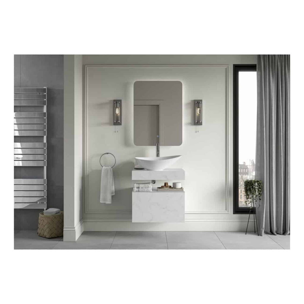 Sleek modern bathroom with a minimalist white vessel sink, large rectangular mirror with backlit LED, stylish wall sconces, and a tall window with grey curtains, creating a contemporary bathroom space.