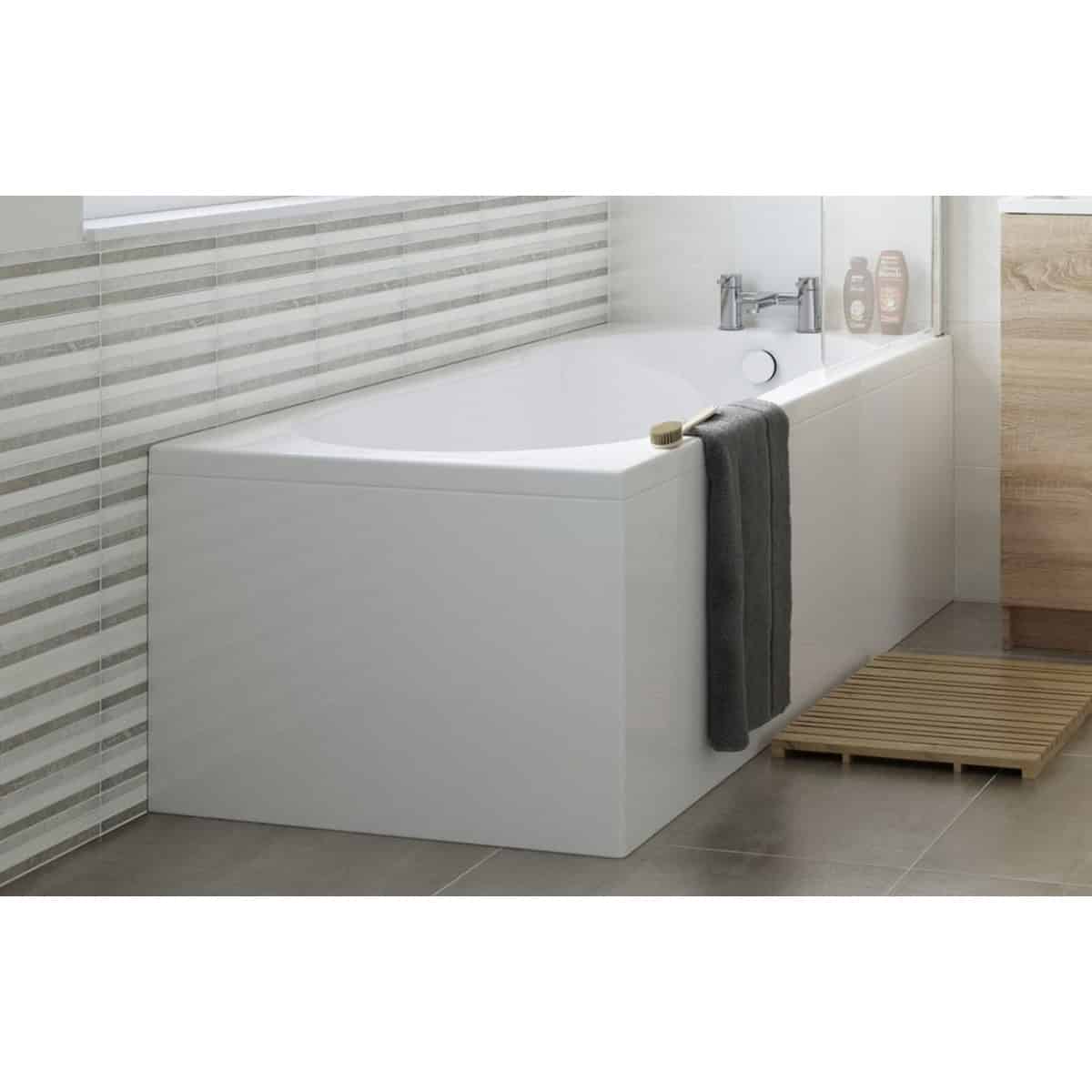 Sleek modern white bathtub with chrome fixtures, grey towel, and wooden bath mat in contemporary bathroom setting, ideal for relaxing bath time.