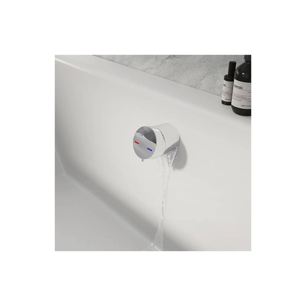 Automatic bath filler valve with temperature controls in a modern white bathroom setting.