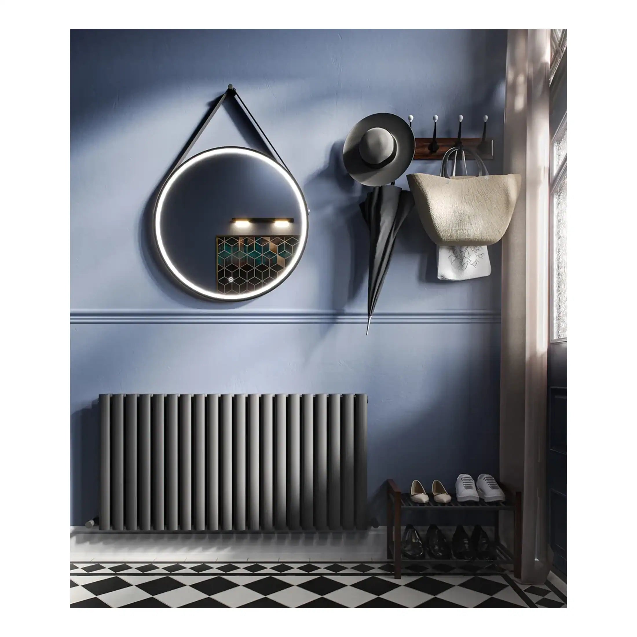 Sleek modern bathroom wall decor with round mirror, coat hooks, and stylish accessories in contemporary design.