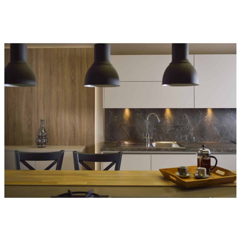 Modern minimalist kitchen with sleek white cabinets, black pendant lights, marble backsplash, and wooden accents, perfect for contemporary bathroom or kitchen design.