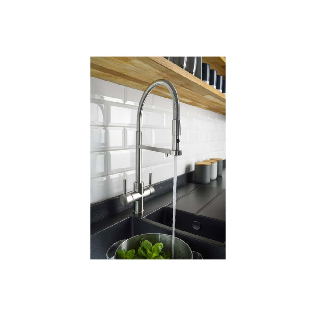 Sleek stainless steel kitchen faucet with pull-down sprayer, installed in a modern contemporary kitchen with black countertops and white subway tile backsplash, for premium kitchen design.