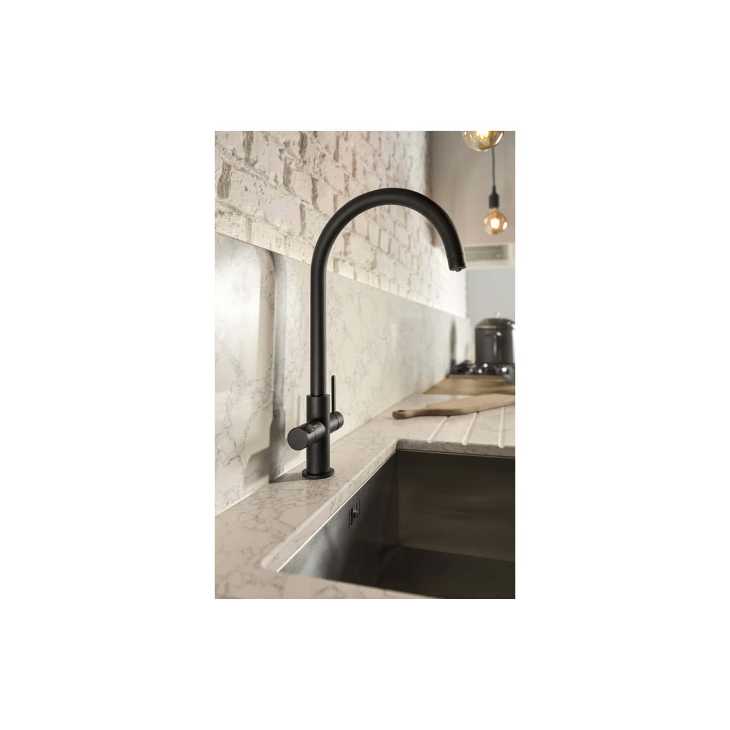 Sleek black kitchen tap with minimalist design, mounted on a marble countertop with a modern backsplash, ideal for contemporary kitchens.