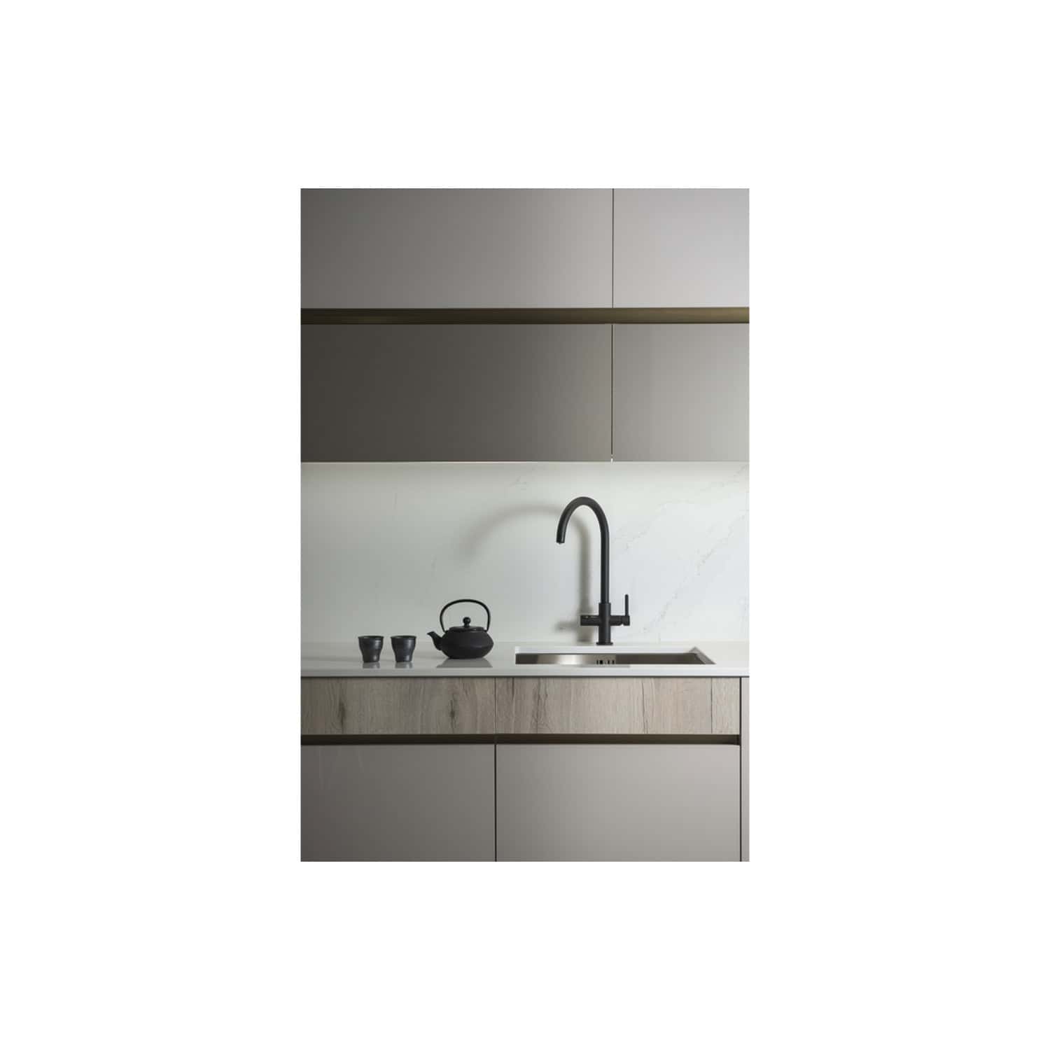 Sleek modern kitchen with minimalist design, matte grey cabinets, and a black matte kitchen tap for contemporary bathroom and kitchen renovations.