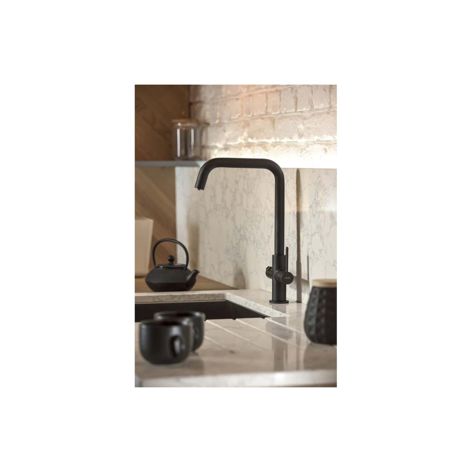 Sleek black kitchen faucet with modern design, installed over a marble countertop in a contemporary bathroom setting. Features a curved spout and single lever control for stylish functionality.