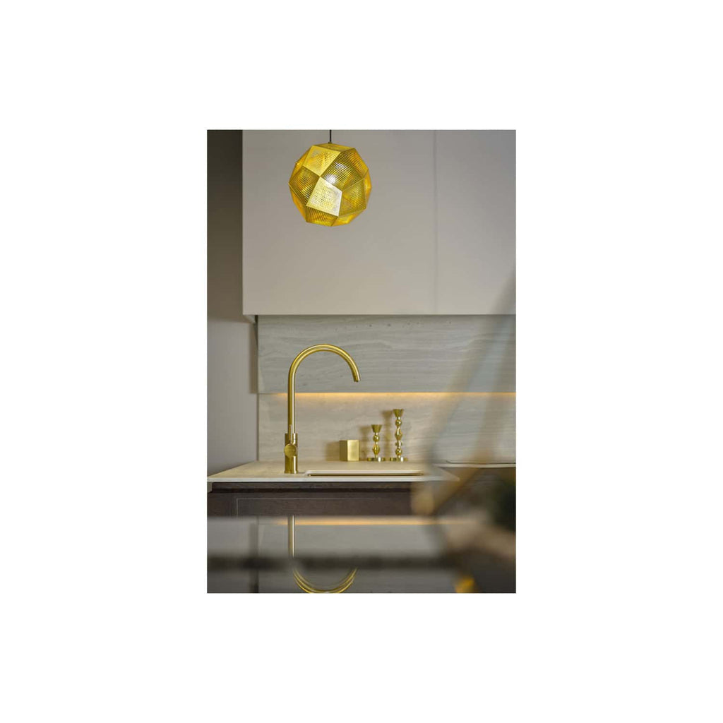 Bright gold kitchen tap with modern style, under yellow geometric pendant light in contemporary bathroom design, featuring neutral tones, marble backsplash, and minimalist décor for luxurious bathroom renovation.