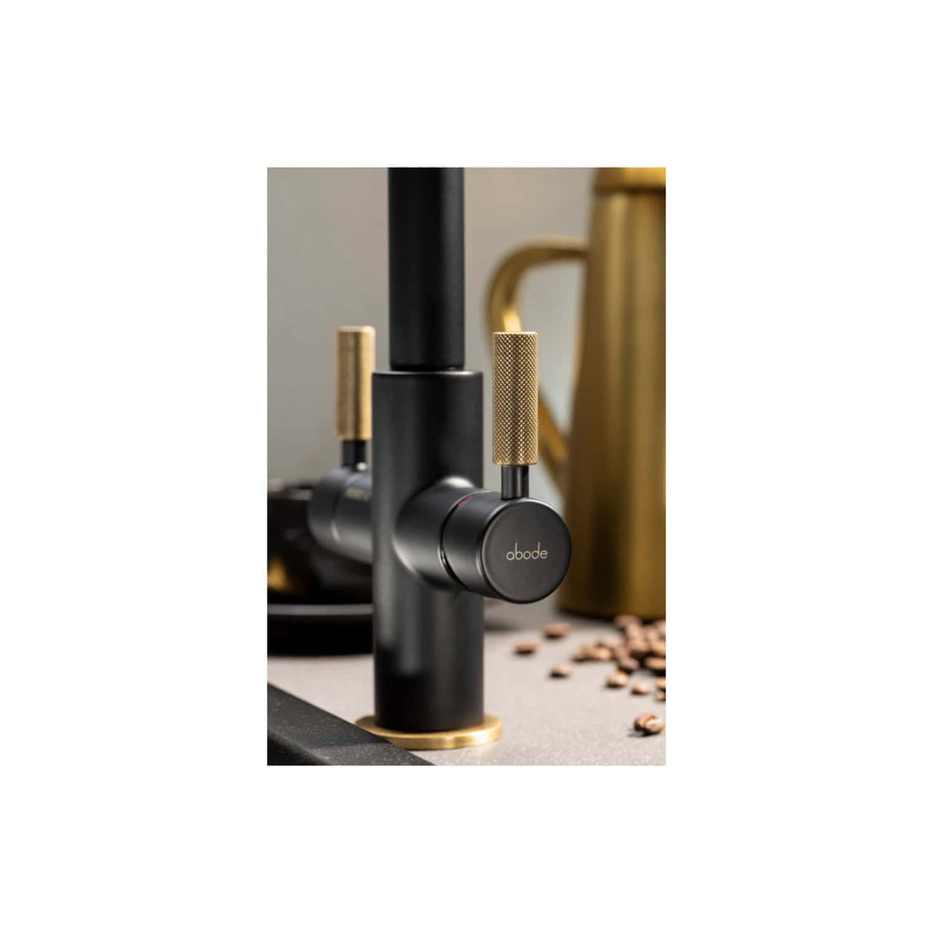 Black and gold modern kitchen tap with a sleek, minimalist design for luxurious bathroom and kitchen upgrades. Durable finish and sophisticated look enhance any contemporary space.