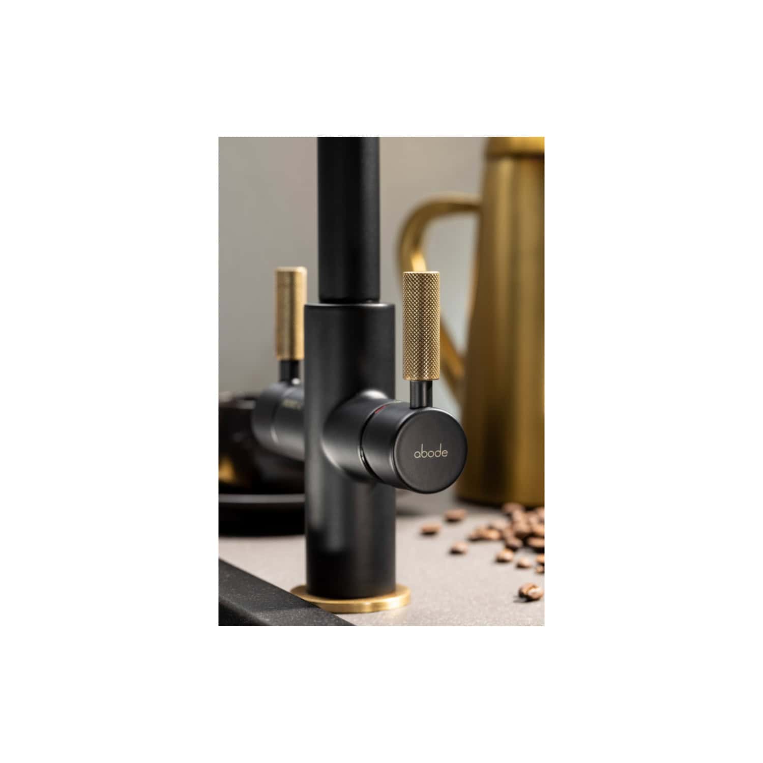 Black and gold modern kitchen tap with a sleek, minimalist design for luxurious bathroom and kitchen upgrades. Durable finish and sophisticated look enhance any contemporary space.