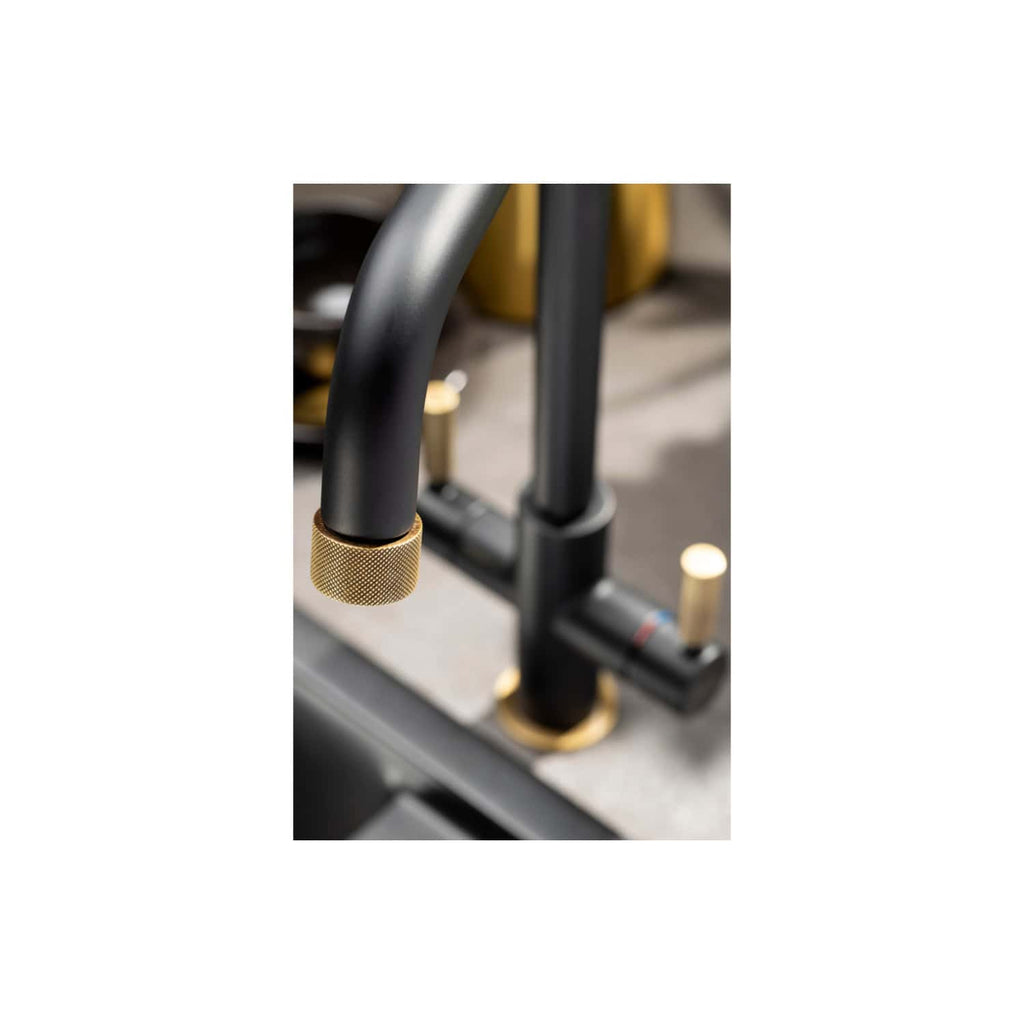Shower faucet with black finish and gold accents, modern bathroom fixtures, contemporary design for luxurious bathrooms, bubly bathrooms UK products showcasing stylish bathroom hardware.