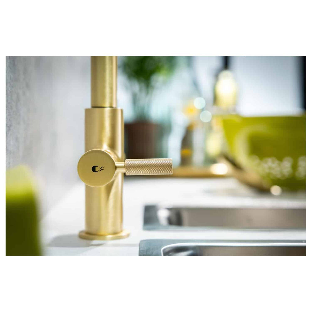 Sleek gold kitchen tap with modern design, close-up shot showcasing luxury bathroom fixtures. Perfect for contemporary Bubly Bathrooms interiors and kitchen renovation ideas.
