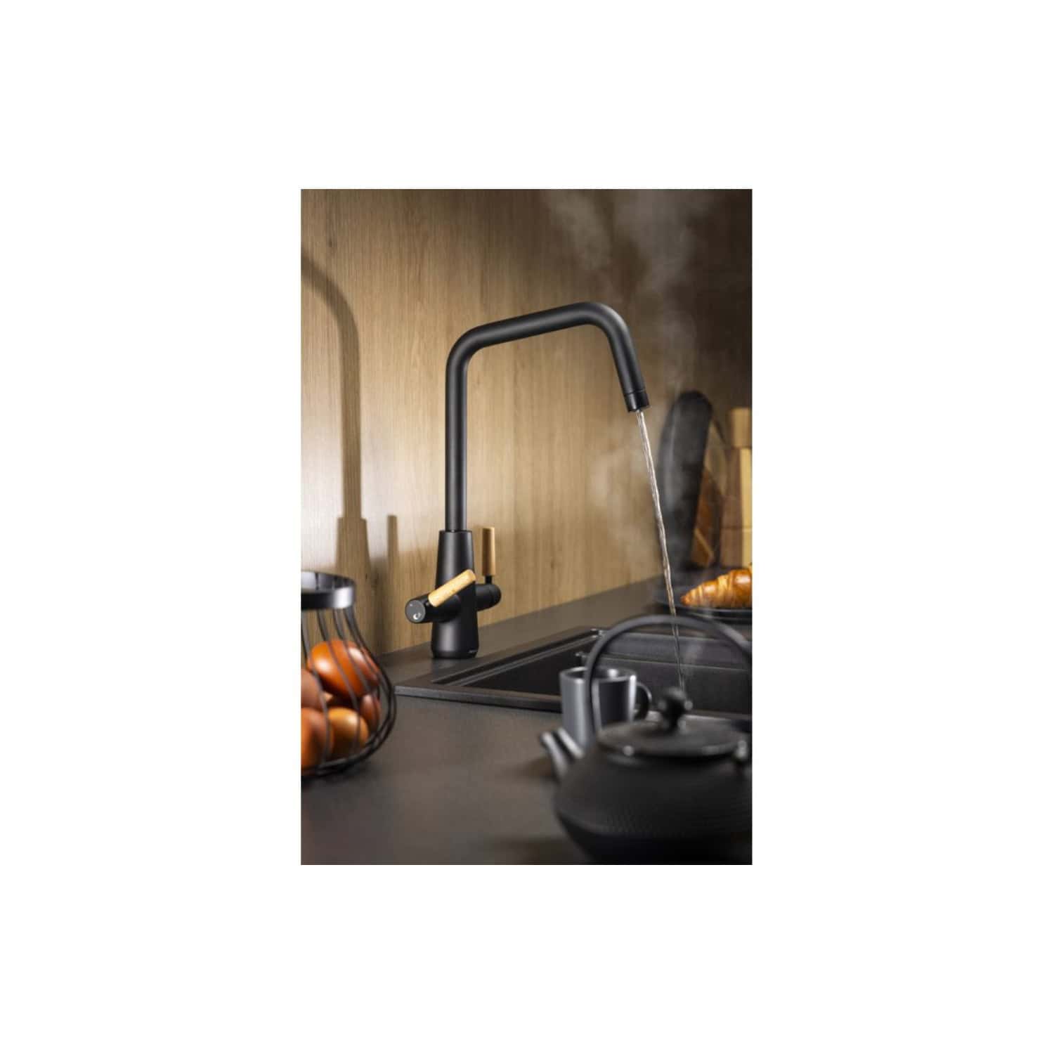 Modern black kitchen tap with wooden handle in a contemporary kitchen setting.