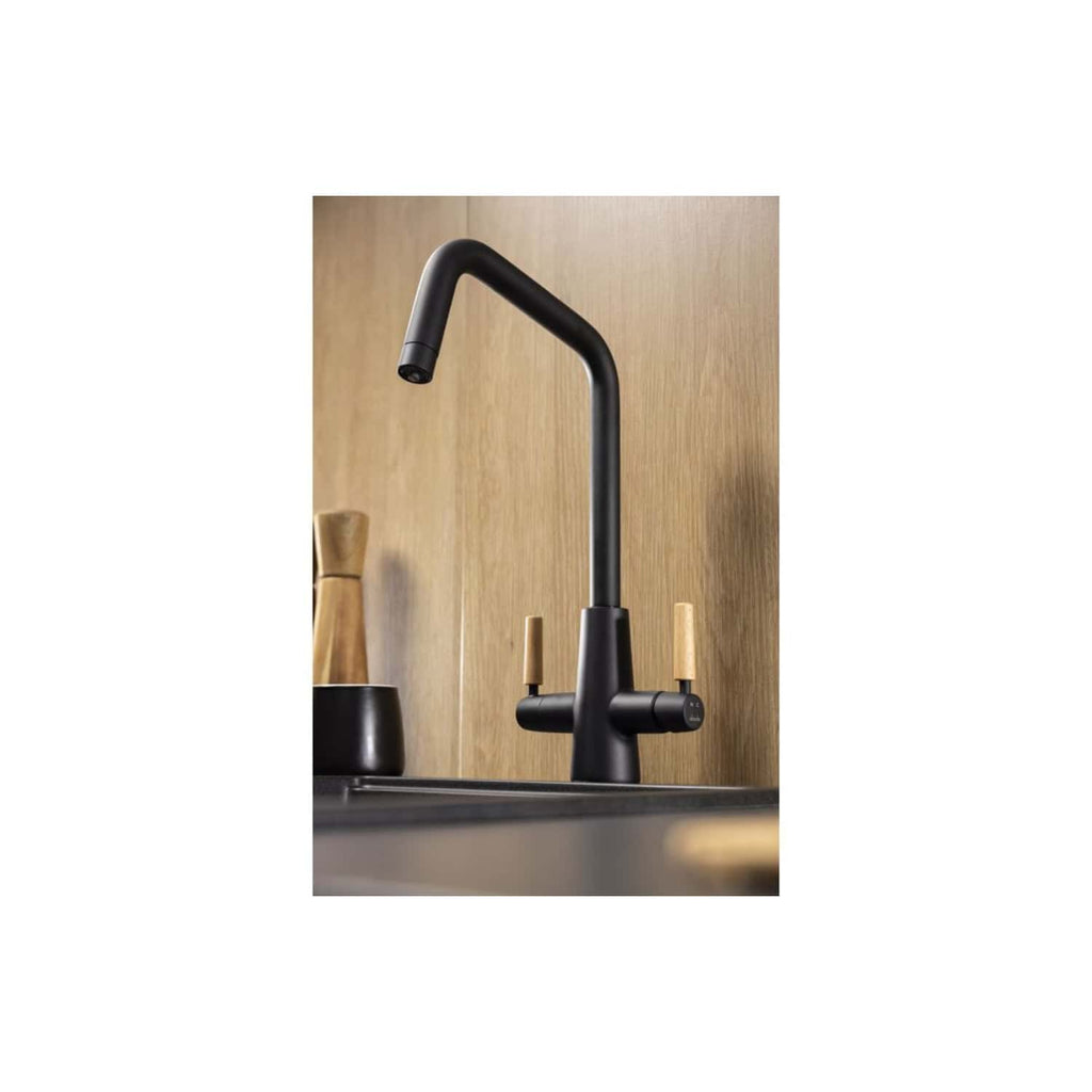Sleek black modern kitchen tap with a minimalist design set against a wooden backsplash, featuring dual-tone handles for hot and cold water control. Perfect for contemporary kitchen interiors.