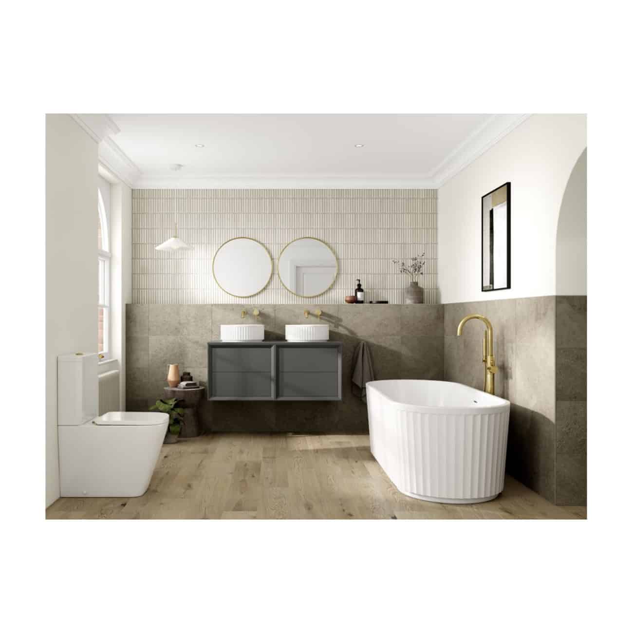 Modern bathroom with freestanding bathtub, dual basin vanity, toilet, and contemporary decor showcasing luxury bathroom fixtures and design.