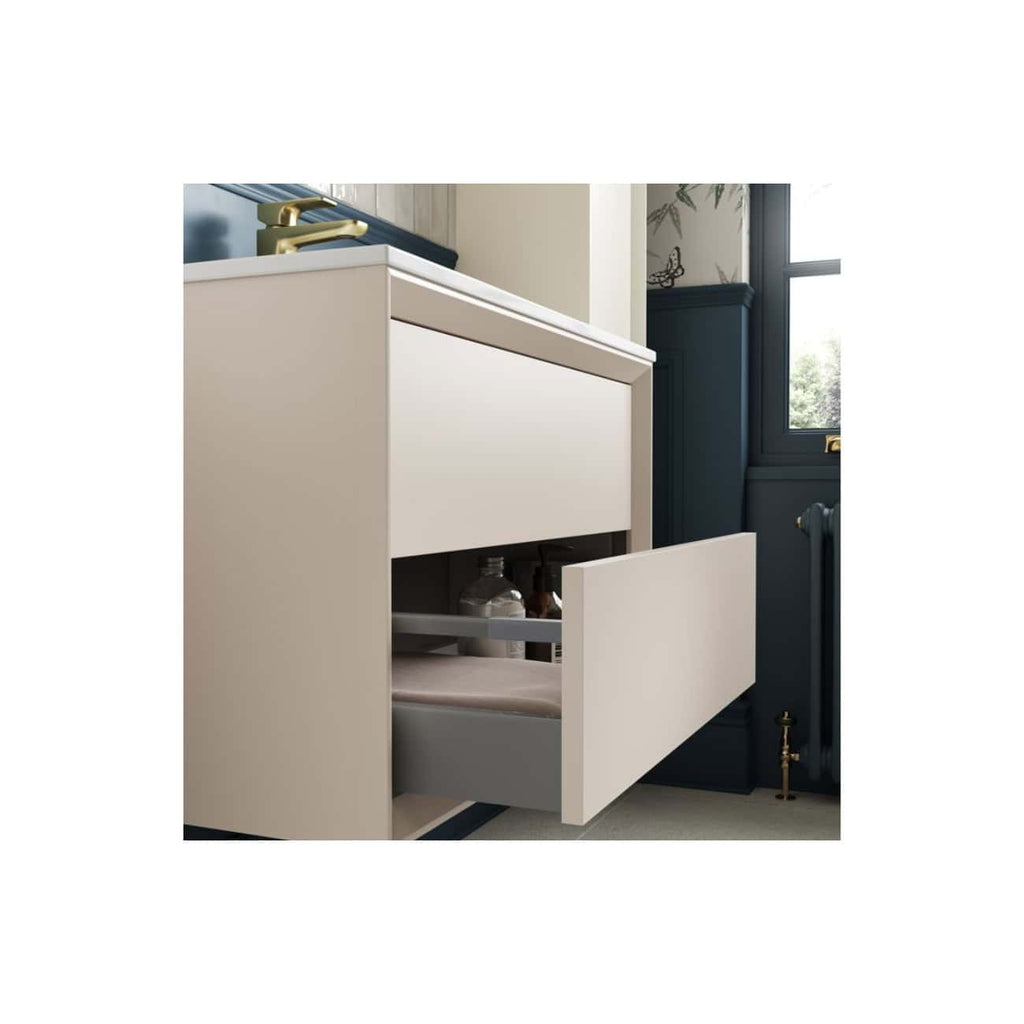 Sleek white bathroom vanity with a partially open drawer showcasing neatly organised storage for bathroom essentials in a modern bathroom setting.