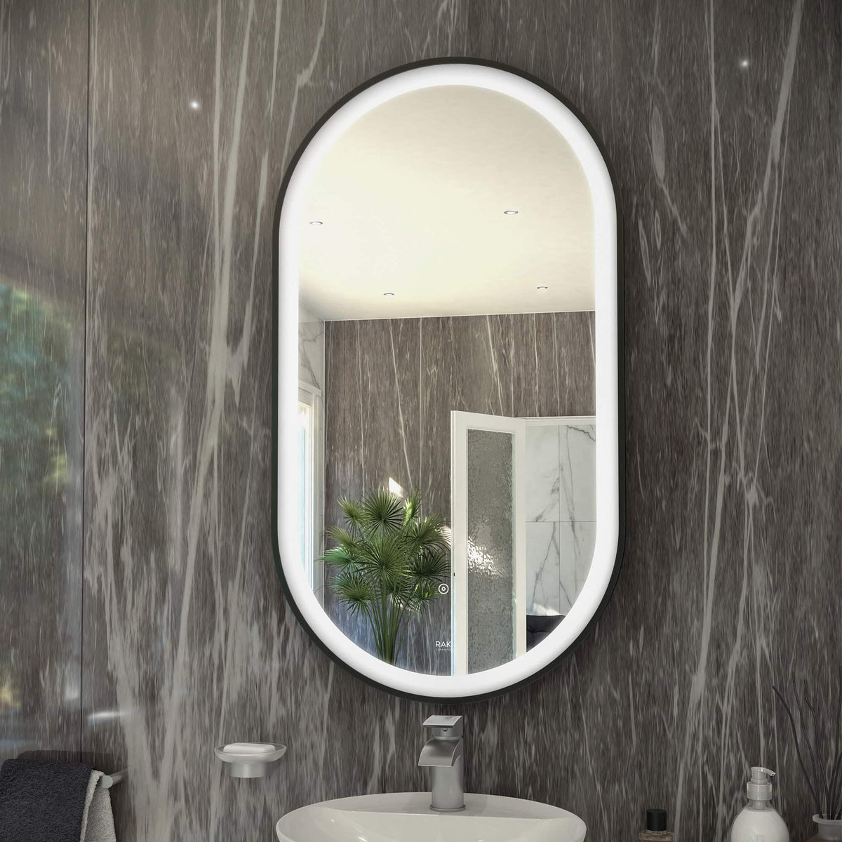 LED illuminated oval bathroom mirror with modern design in a stylish bathroom.