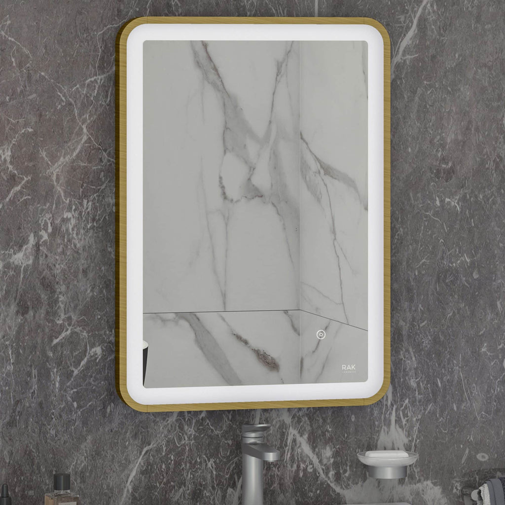 Sleek modern bathroom mirror with integrated LED lighting and marble wall background. Perfect for contemporary bathroom decor, combining style and functionality.