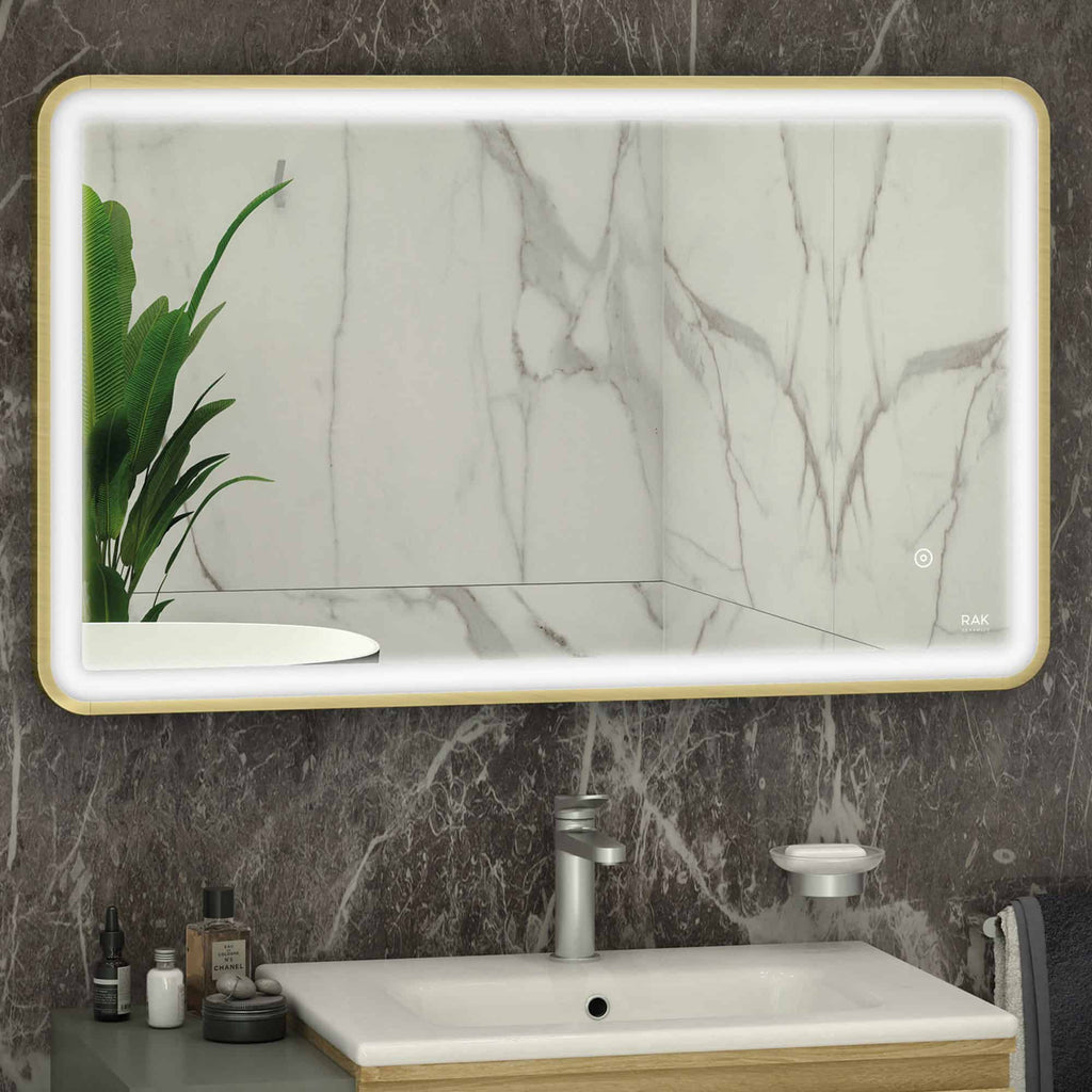 Glossy white bathroom mirror with LED lighting and marble wall background, modern vanity sink with chrome faucet, minimalist bathroom accessories, and a decorative green plant, sleek and contemporary bathroom design.