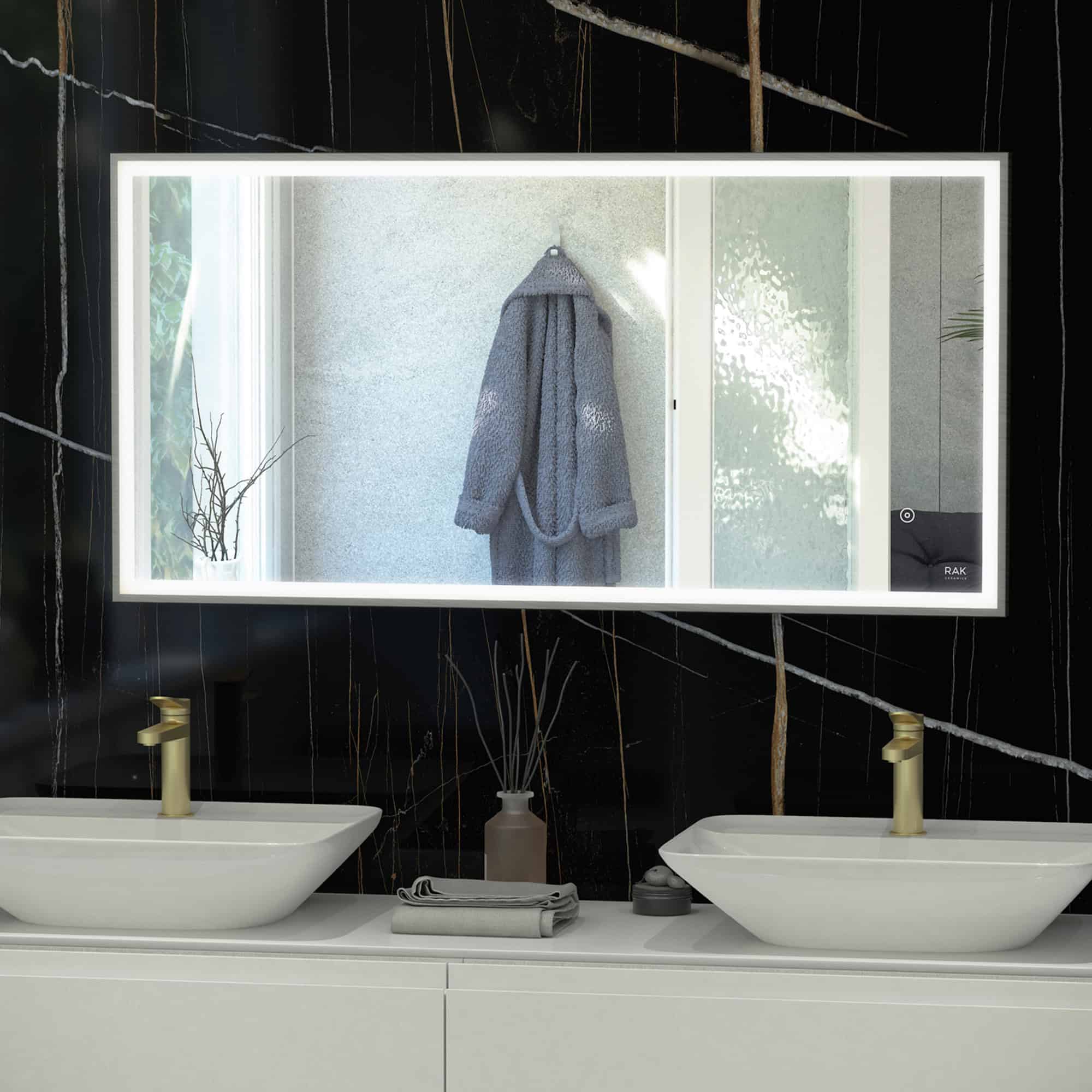 Stylish modern bathroom vanity with two vessel sinks, gold-tone faucets, and a backlit mirror, showcasing contemporary bathroom design ideas.