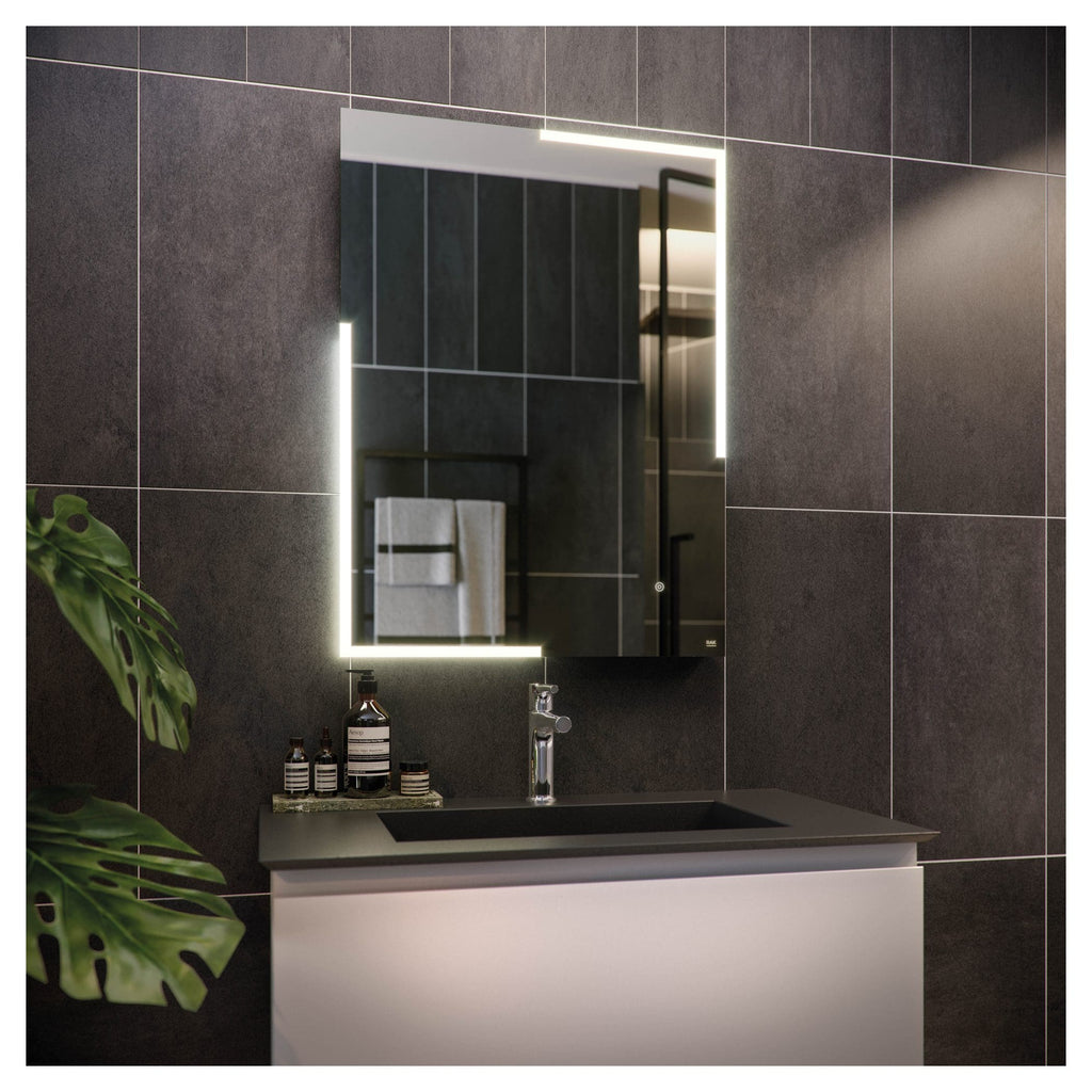 Sleek modern bathroom vanity with illuminated mirror, dark tiled wall, and minimalist black basin, showcasing contemporary bathroom design and fixtures.