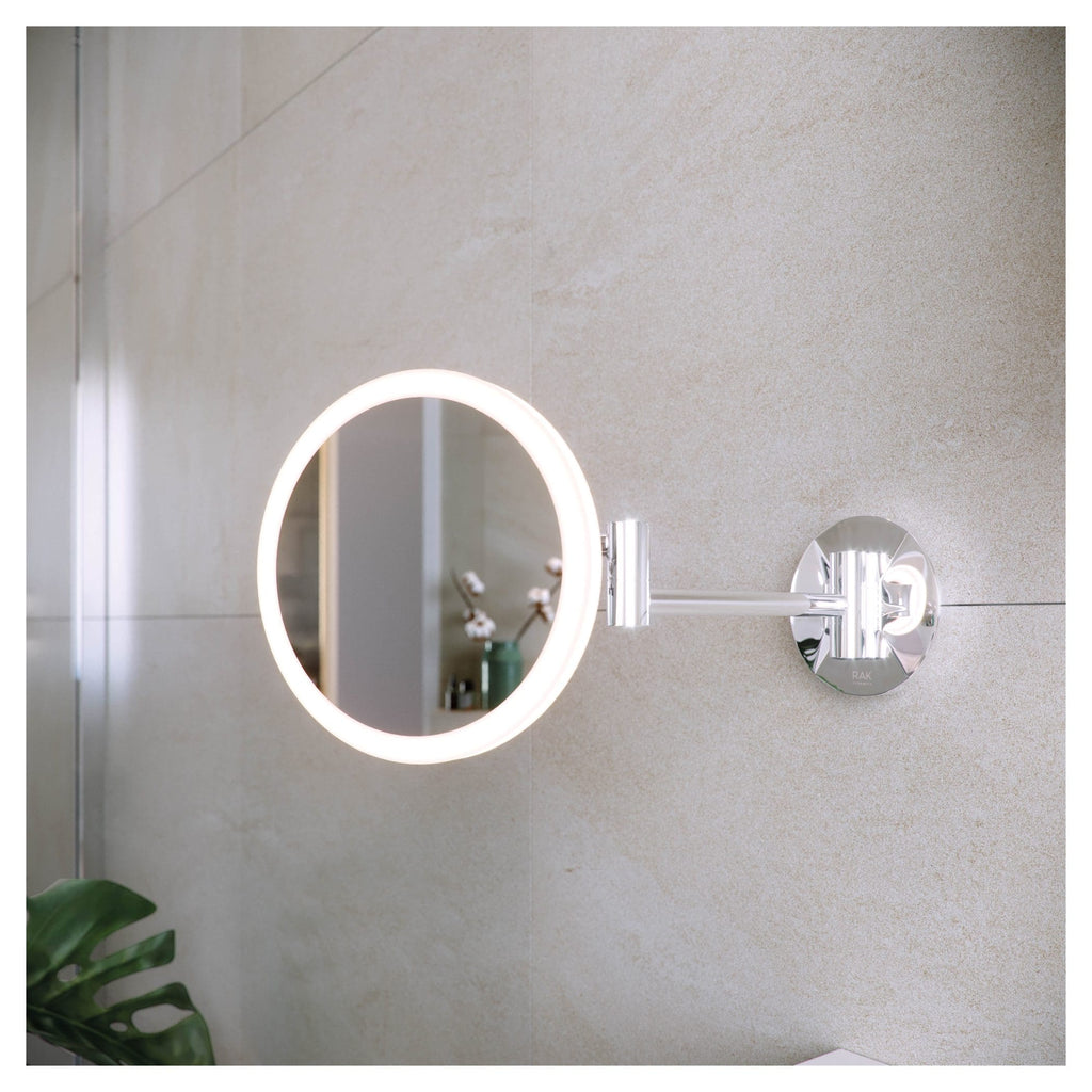 LED illuminated round wall mirror with extendable arm, modern bathroom decor at Bubly Bathrooms, perfect for contemporary interiors.