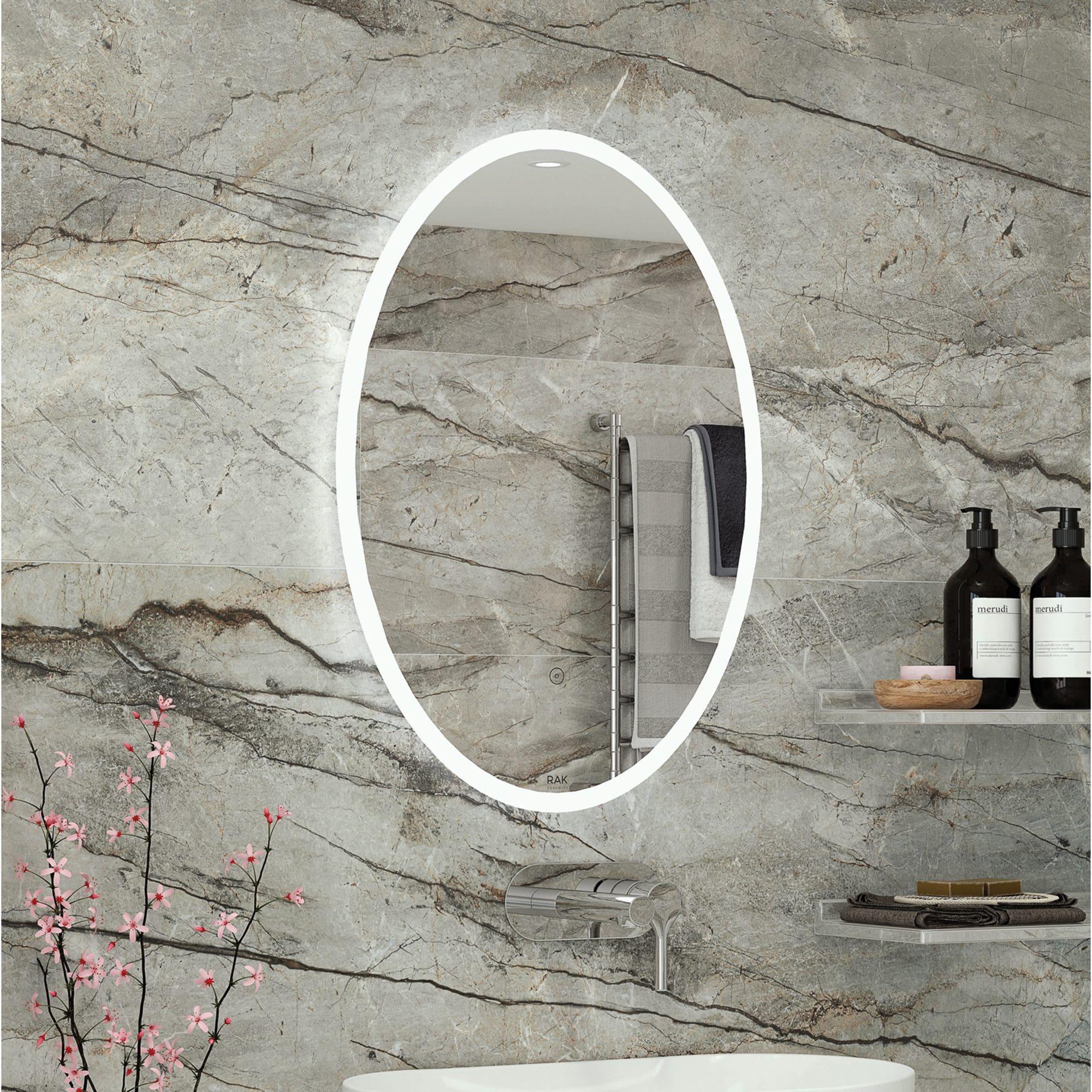 Bright LED illuminated oval bathroom mirror with modern style, installed on a natural marble wall. Perfect for stylish bathrooms, featuring sleek design and integrated lighting.