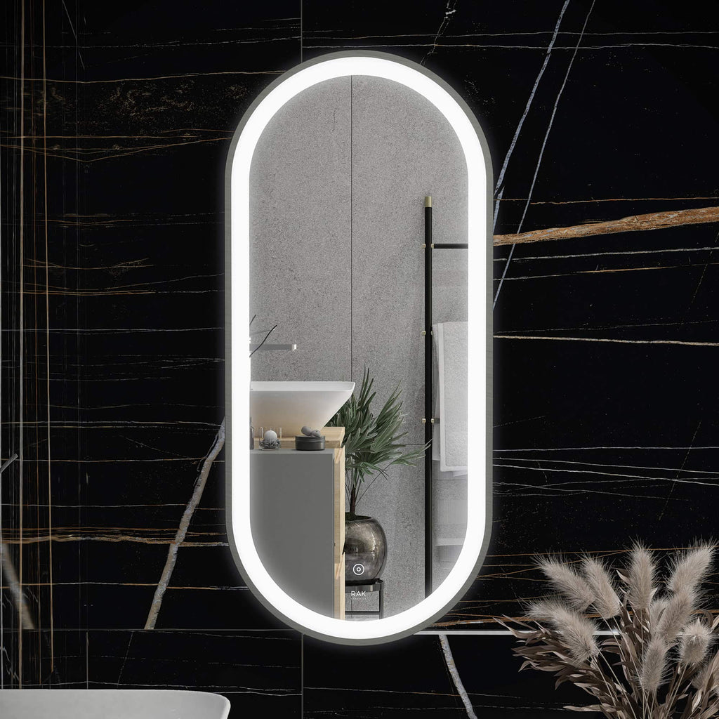 Reflective oval mirror with LED lighting in modern bathroom with black marble walls and minimalist decor, showcasing stylish bathroom design and contemporary fixtures.
