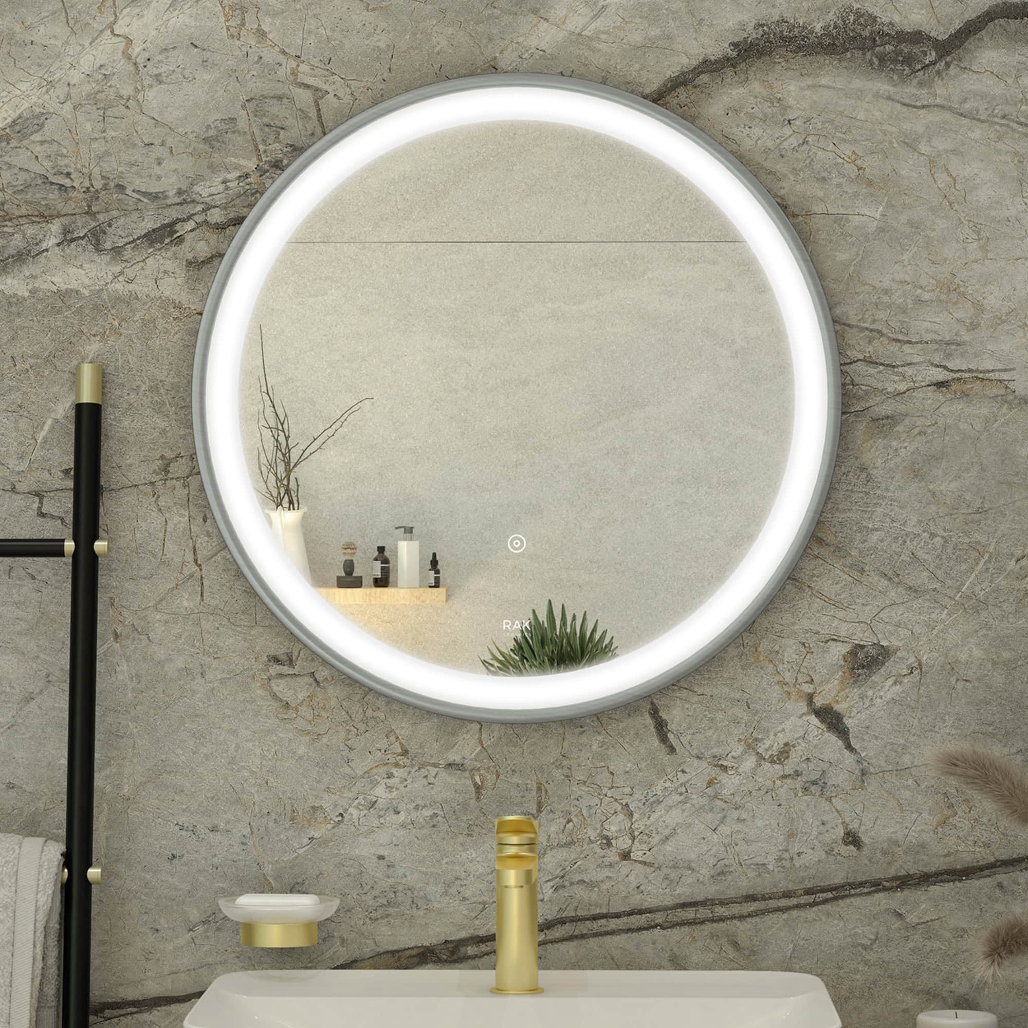 Sleek modern bathroom mirror with LED lighting, mounted on a textured stone wall, featuring minimalist decor and elegant fixtures by Bubly Bathrooms.