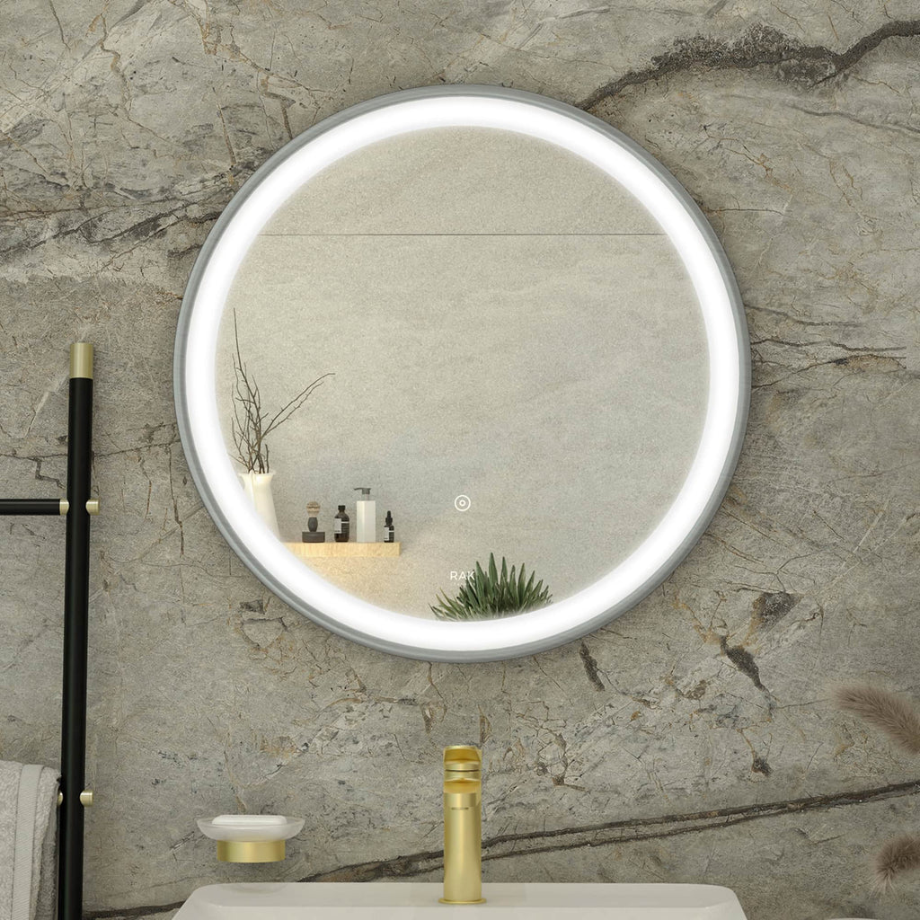 Bright LED-framed round bathroom mirror mounted on textured stone wall with modern decor and toiletries.