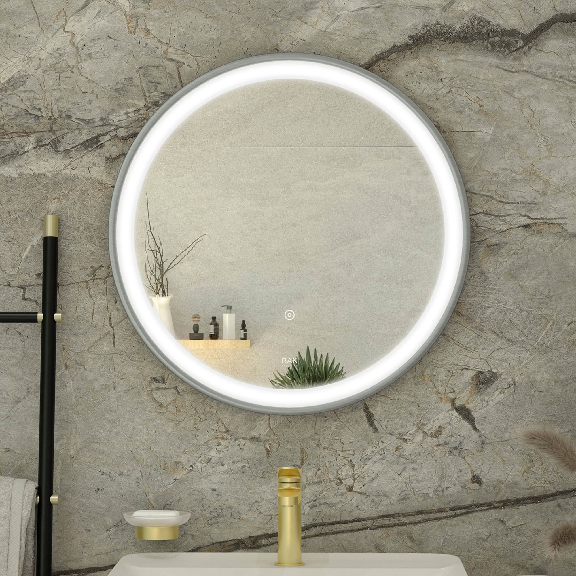 Bright LED-framed round bathroom mirror mounted on textured stone wall with modern decor and toiletries.