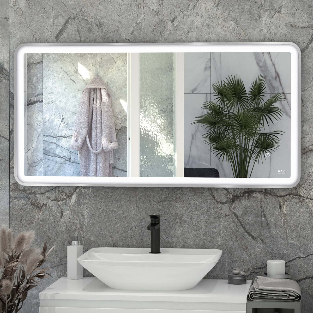 Contemporary bathroom with marble tiles, modern sink, large illuminated mirror, and decorative plant for a stylish and functional space.