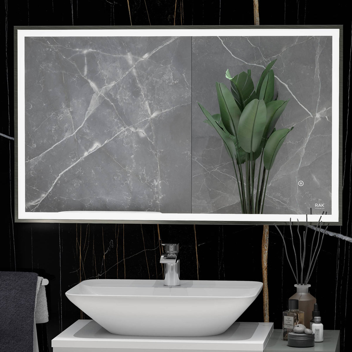 Contemporary bathroom vanity with a unique ceramic sink, decorated with modern accessories and lush green plant, against a luxurious dark marble wall, showcasing stylish bathroom design.