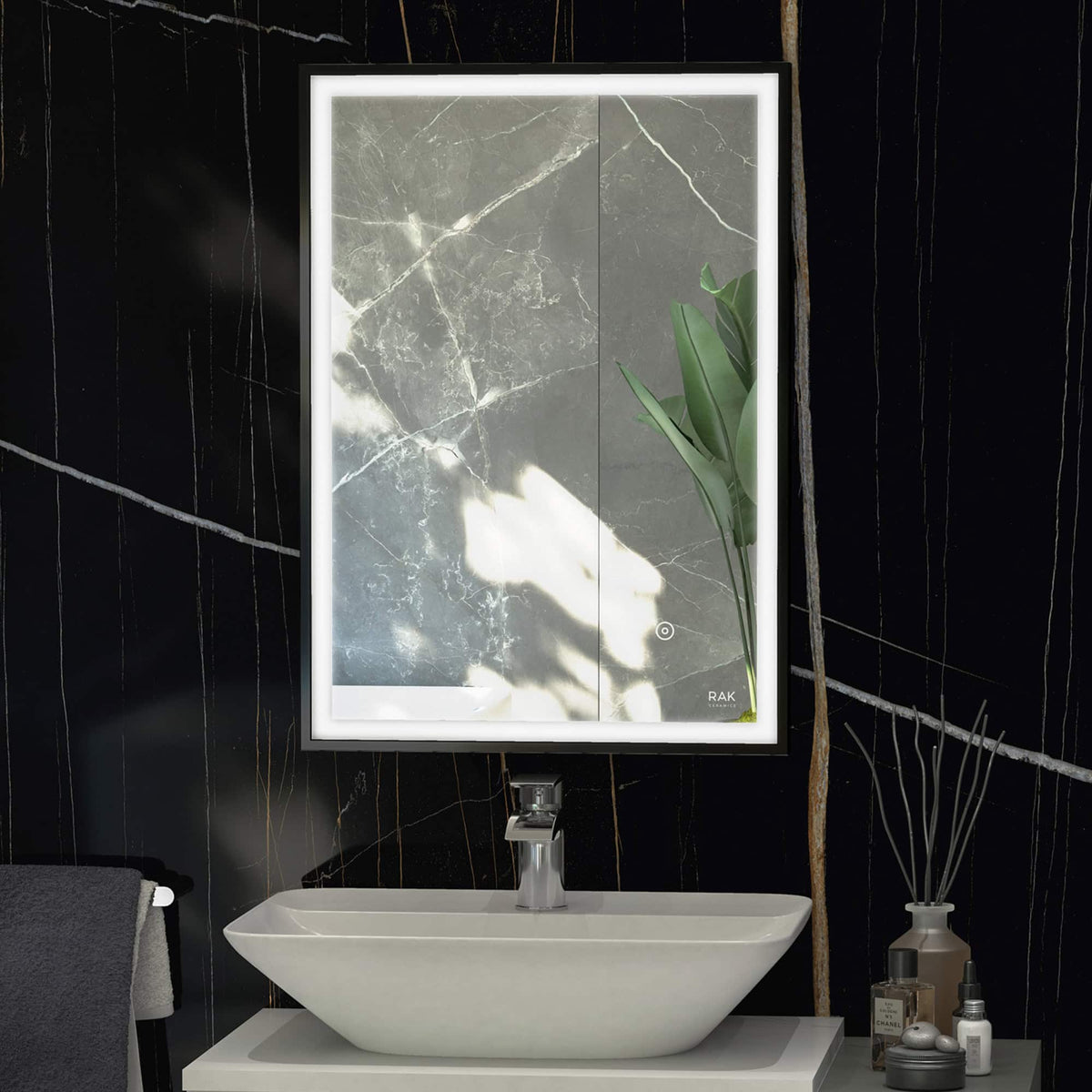 Modern illuminated bathroom mirror with built-in LED lighting and sleek marble wall background.