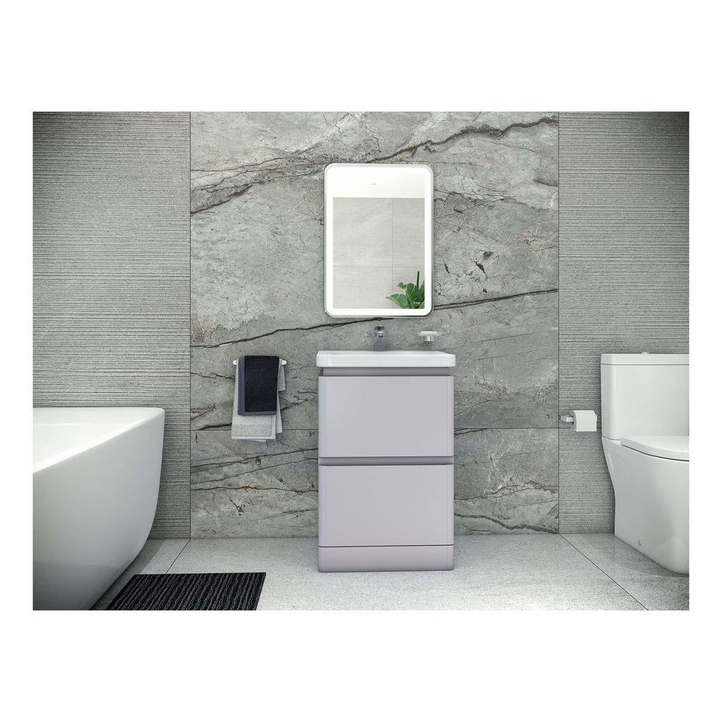 Modern bathroom vanity unit with integrated sink and contemporary mirror, set against textured stone and tile wall for a sleek and stylish bathroom design.