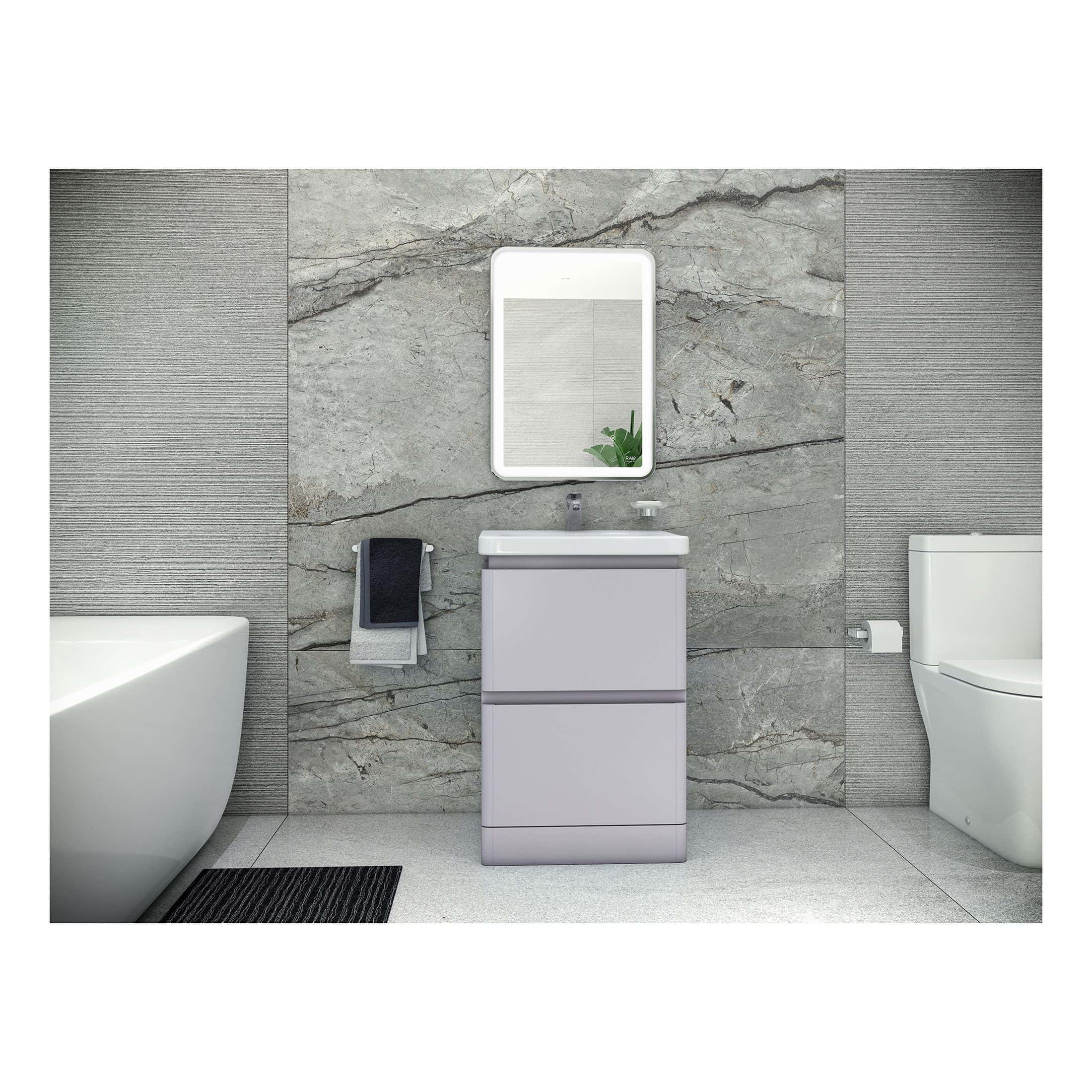 Modern bathroom vanity unit with integrated sink and contemporary mirror, set against textured stone and tile wall for a sleek and stylish bathroom design.