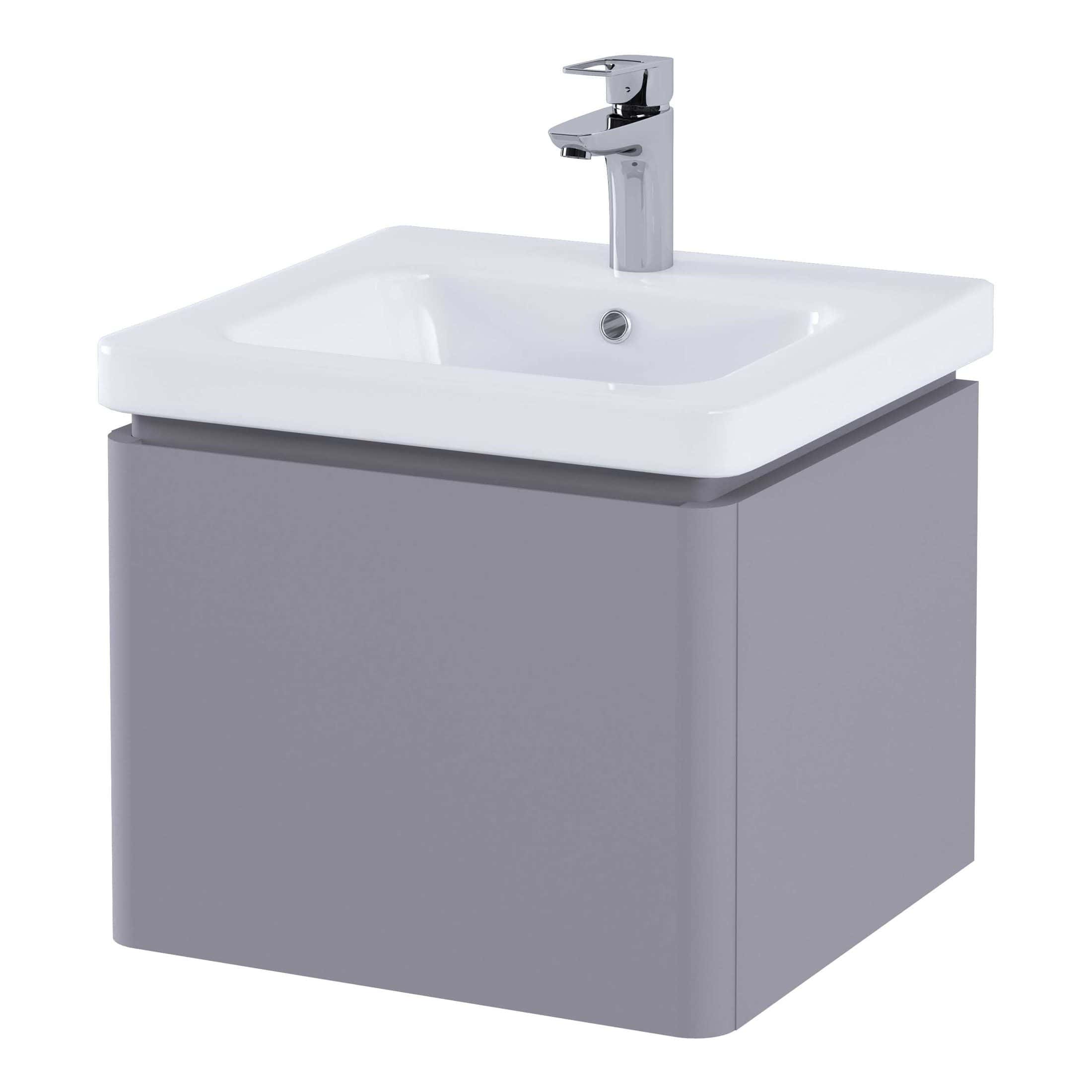 Clear modern bathroom sink with a sleek chrome tap, mounted on a grey vanity unit, ideal for contemporary bathroom or ensuite designs. Perfect for stylish bathroom upgrade or renovation.