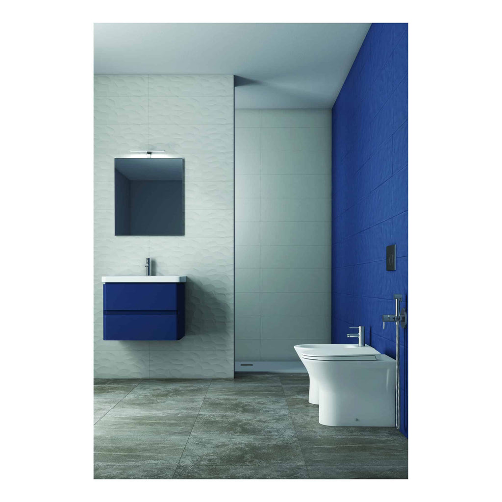 Modern bathroom interior with white and blue wall tiles, contemporary vanity unit, mirror, and toilet, featuring sleek design and neutral flooring for a stylish and functional space.