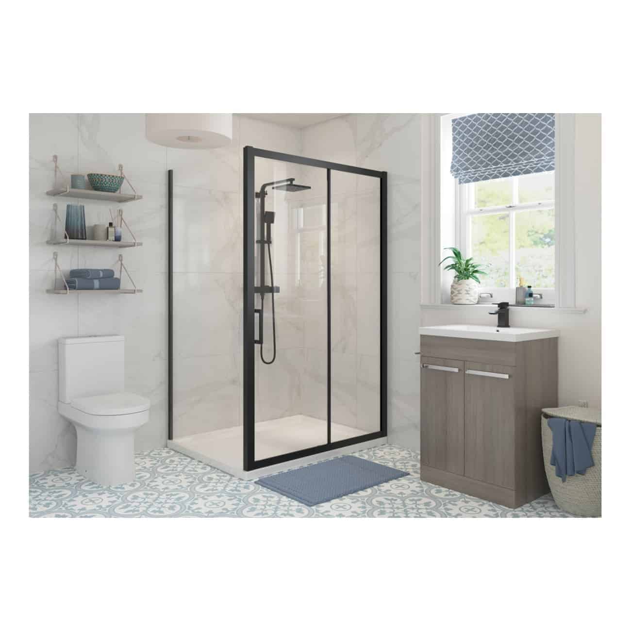 Sleek shower enclosure with black frame in a modern bathroom featuring a floating vanity, patterned floor tiles, and natural light from a window. The space combines contemporary design with functional bathroom fixtures.