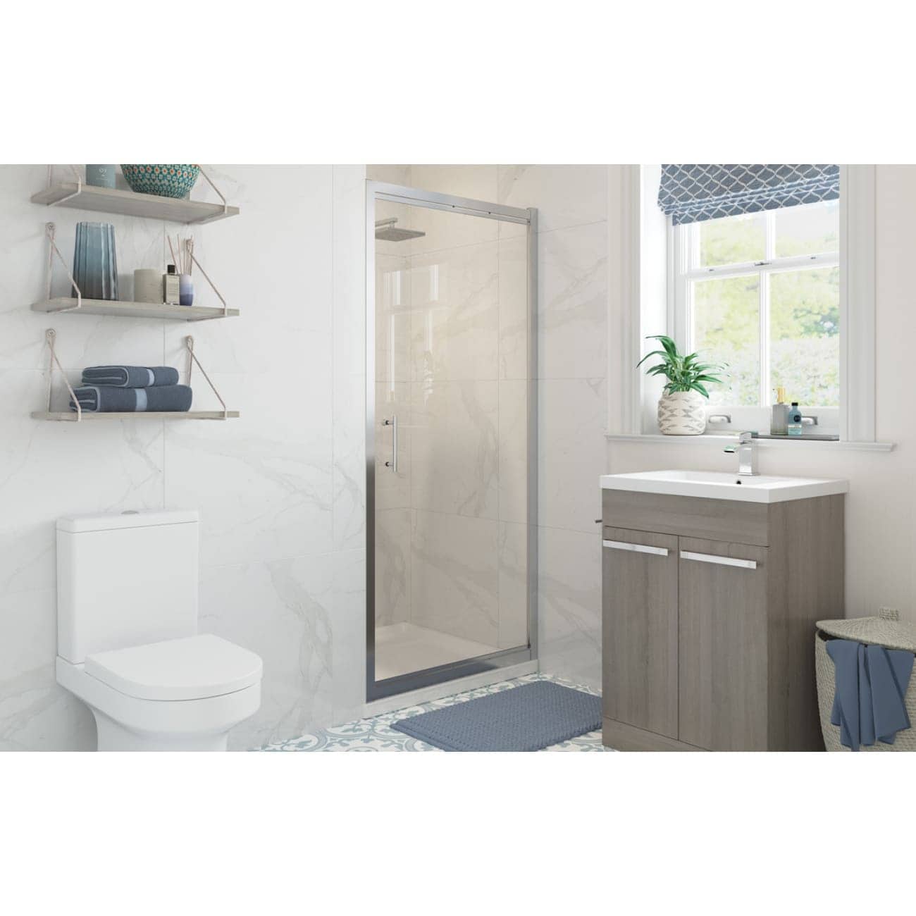 Modern Bathroom with walk-in shower, wall-mounted toilet, grey vanity unit, and natural light from a large window, featuring stylish accessories and a calming blue colour scheme.