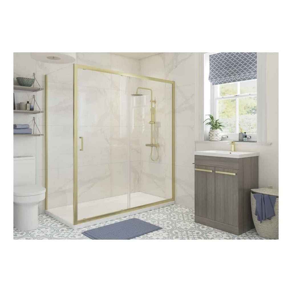 Bright modern bathroom featuring a glass shower enclosure with gold trim, contemporary grey vanity with gold accents, patterned tiled floor, and a large window with a blue Roman blind, creating a stylish and functional space.