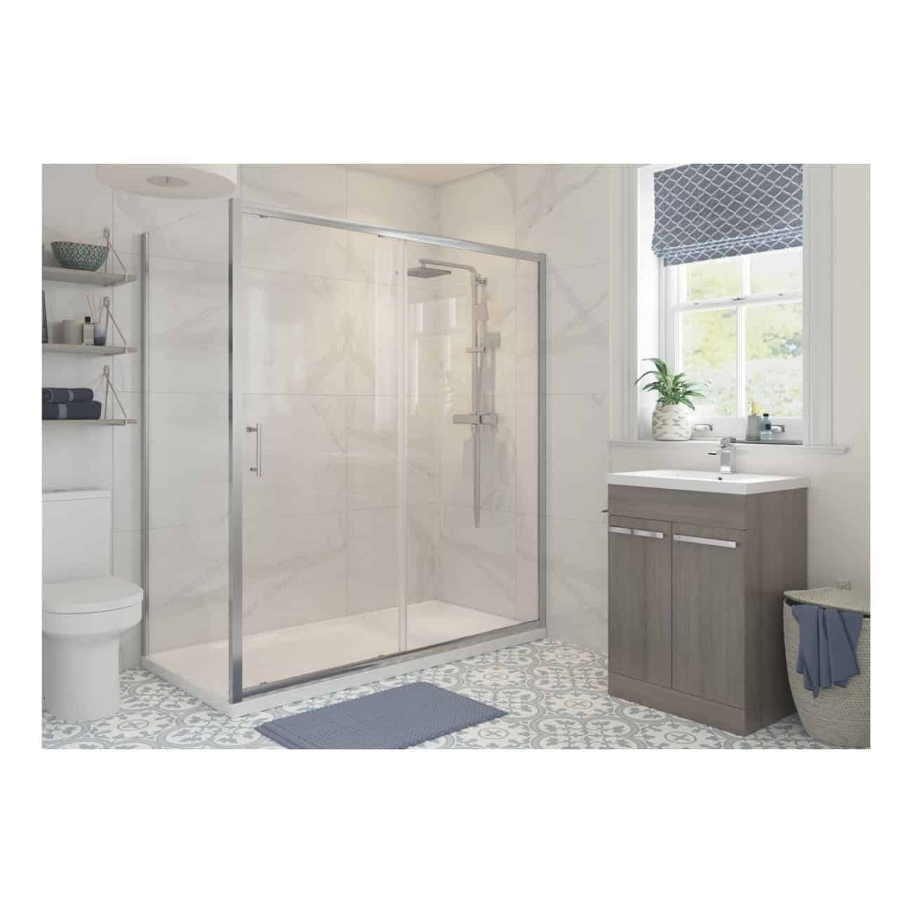 Modern bathroom with glass shower enclosure, white marble walls, wooden vanity, patterned floor tiles, and natural light from a window. Perfect for stylish bathroom renovation ideas.