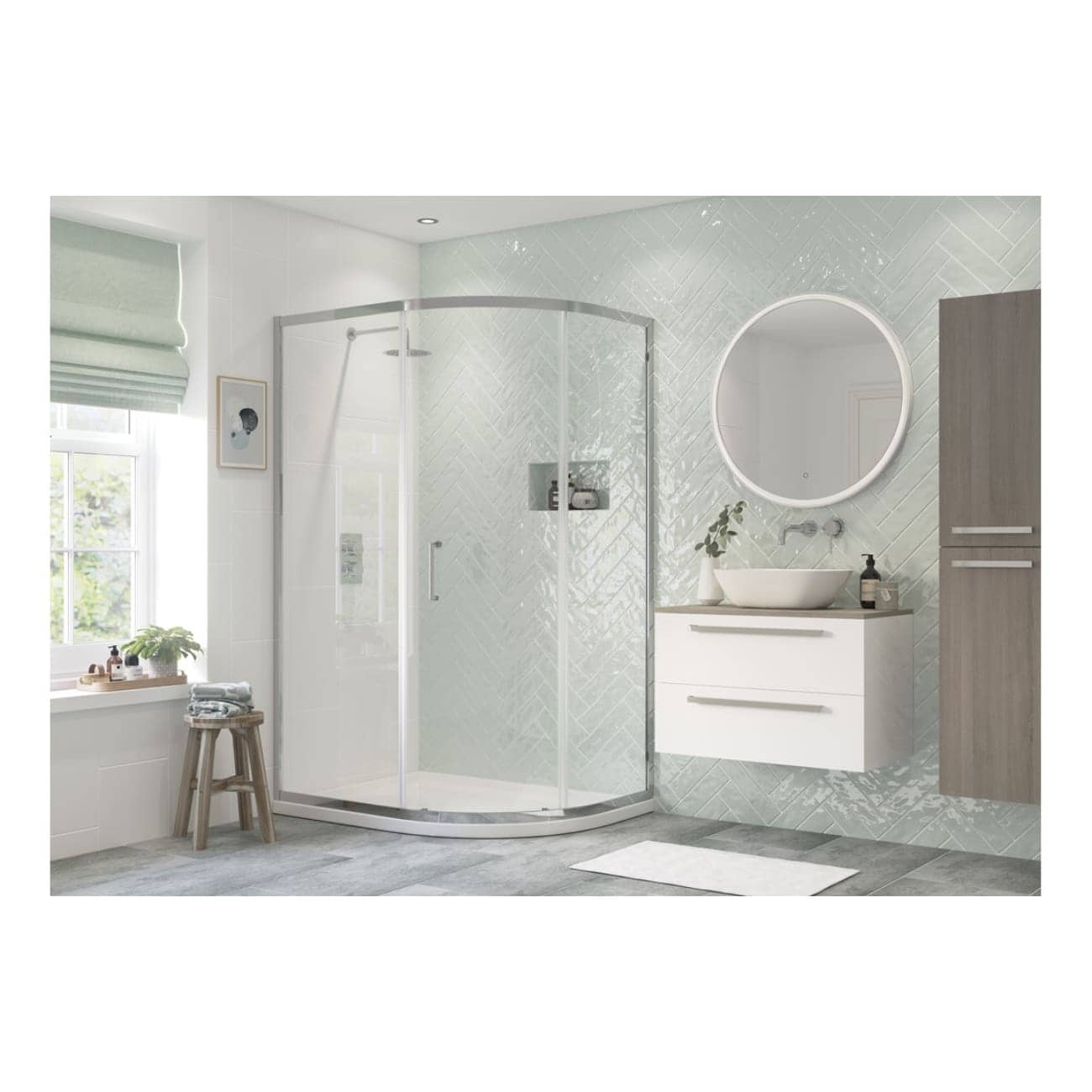 Modern bathroom with a glass shower enclosure, contemporary vanity with vessel sink, large round illuminated mirror, and stylish light grey and white tiled walls. Perfect for a sleek, minimalist bathroom design.
