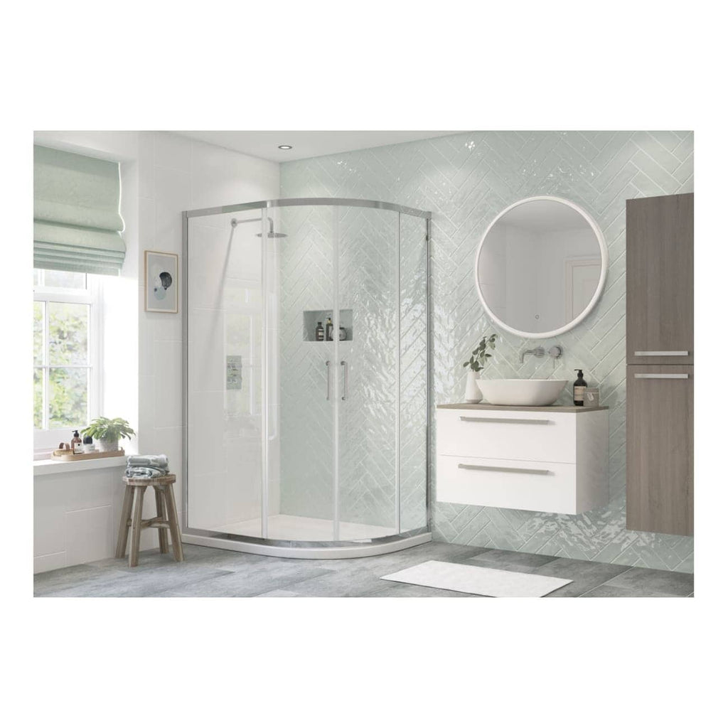 Modern white corner shower enclosure with glass doors, sleek bathroom vanity with vessel sink, round backlit mirror, and neutral decor in contemporary bathroom design.