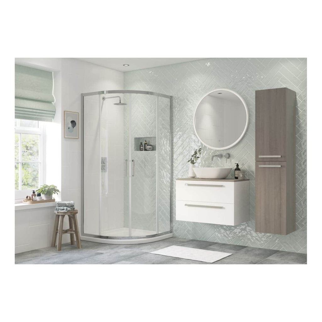 Contemporary bathroom with a corner shower enclosure, modern vanity with vessel sink, round illuminated mirror, and minimalistic storage cabinet, designed by Bubly Bathrooms.