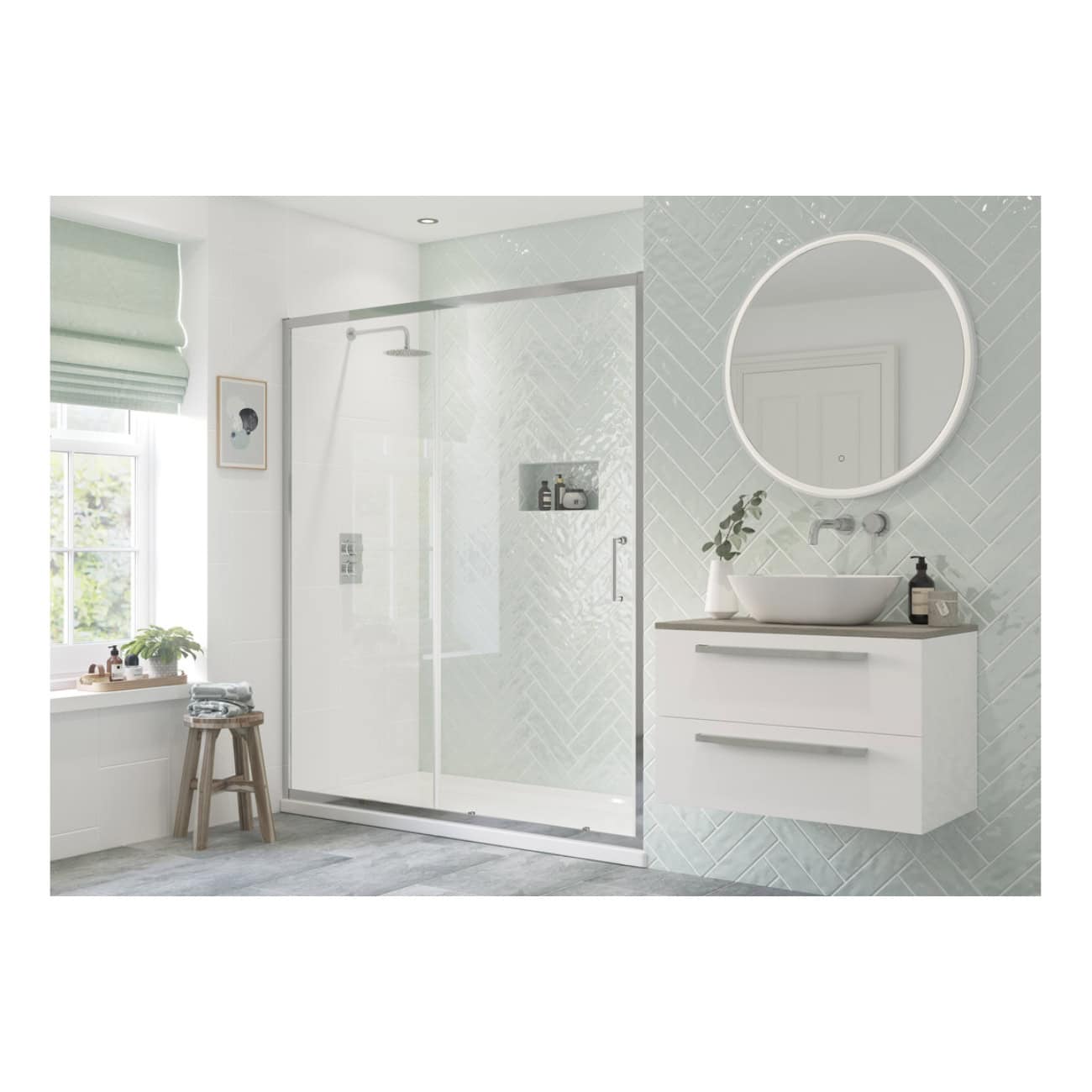 Bright modern bathroom featuring a walk-in shower with glass enclosure, wall-mounted vanity with vessel sink, round LED mirror, soft green window blinds, and neutral decor for a minimalist aesthetic.