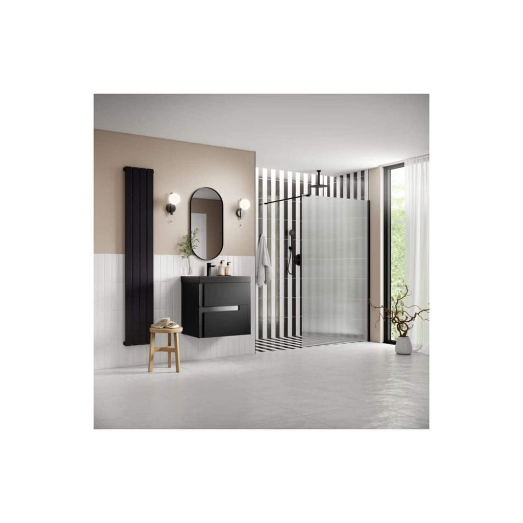 Modern black and white bathroom with a sleek vanity, oval mirror, striped accent wall, walk-in shower with glass panel, large window with white curtains, and decorative plants for stylish bathroom design.