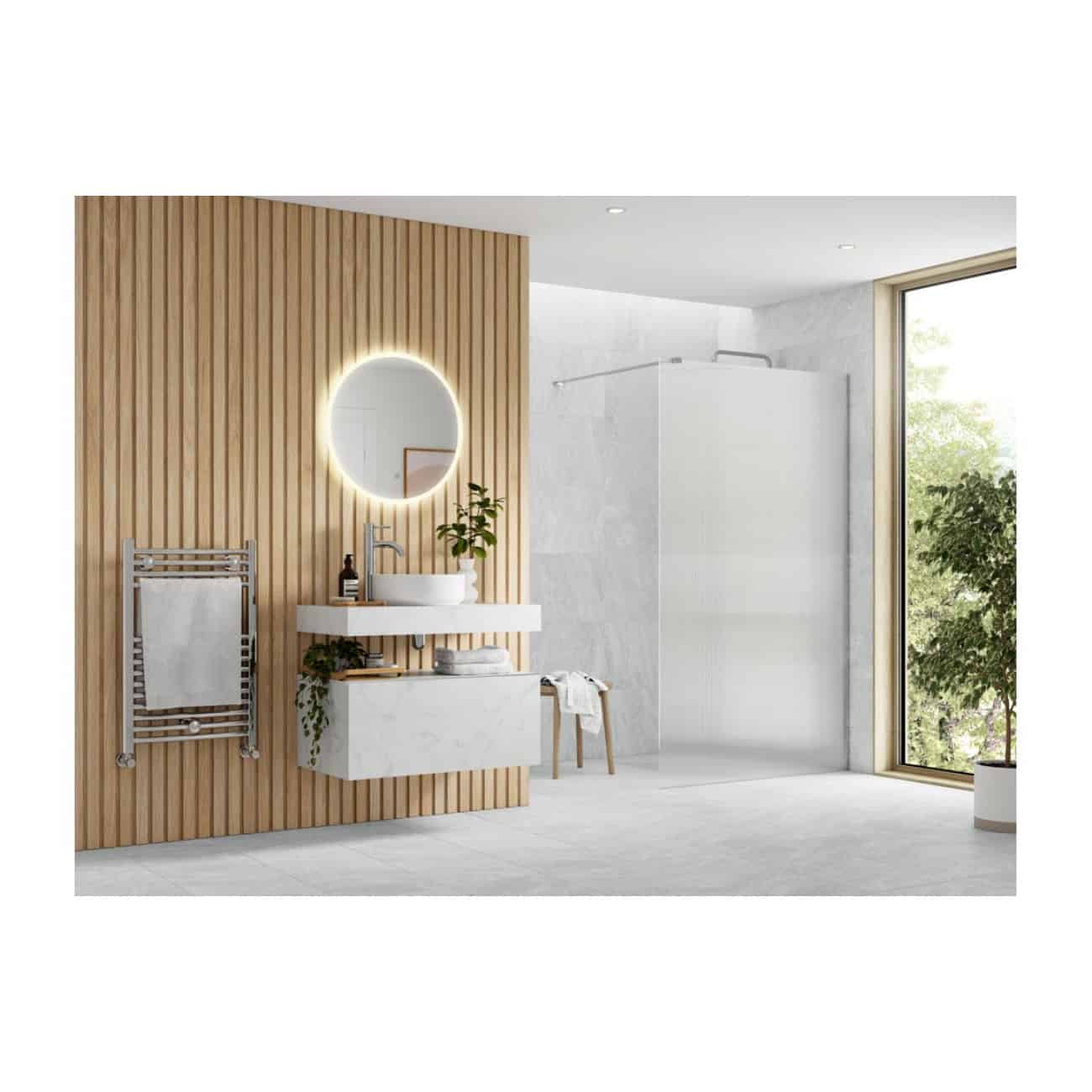 Minimalist bathroom design with a white floating vanity, round backlit mirror, wooden wall paneling, and a large window bringing in natural light. Features modern fixtures and greenery for a calming environment.